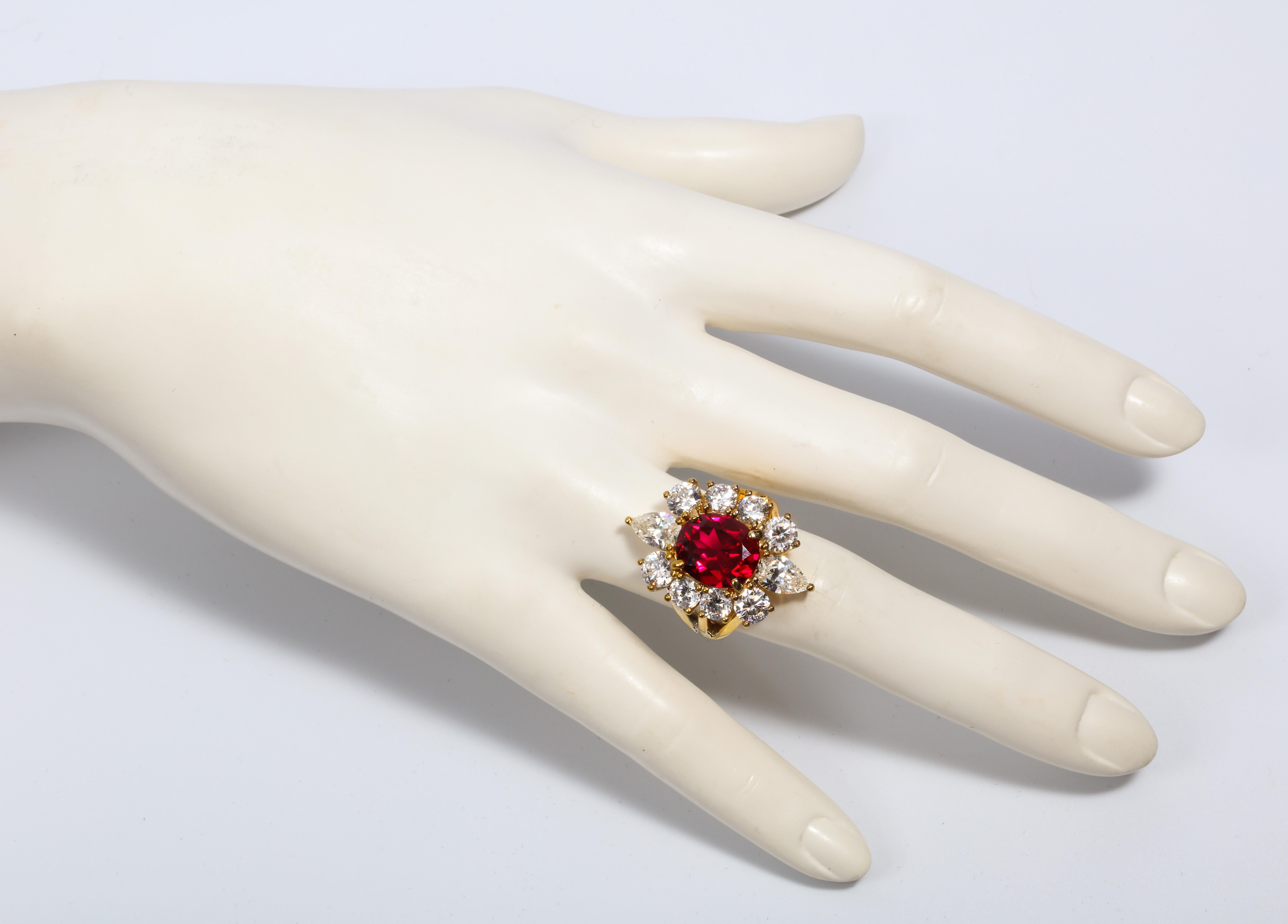 Magnificent  Costume Jewelry Classic Man Made Burma Ruby CZ Diamond  Halo Cluster Vermeil Ring Set With Round And Pear Shape CZ Centering A Man Made Burma 5 Carat Ruby . Measures 3/4'' by 1''.   Free Sizing