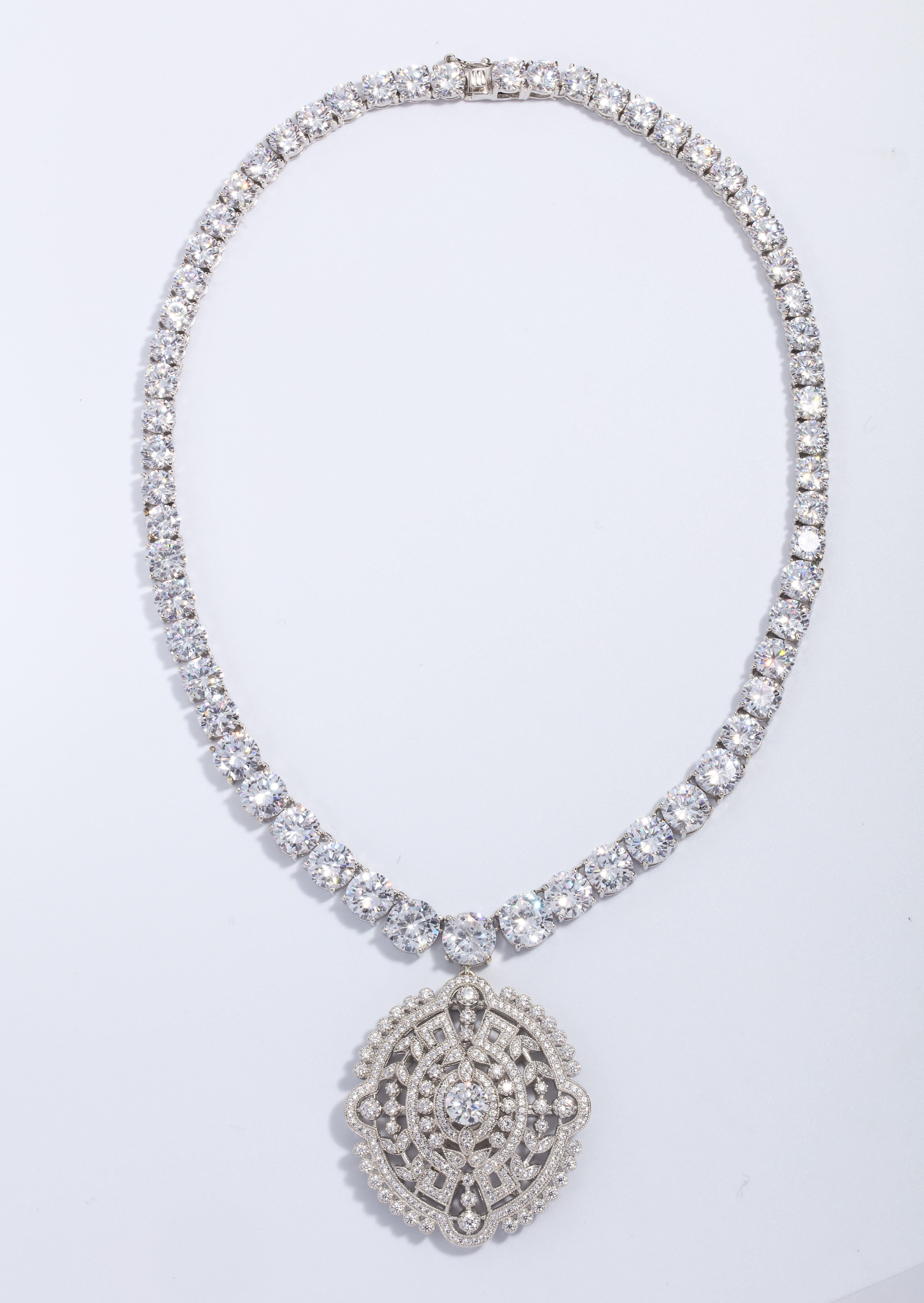 Magnificent Costume Jewelry Edwardian Style Faux Diamond Pendant Necklace
Set with Cubic Zirconia, the necklace is 15 inches long, the pendant is nearly 4.5 inches diameter.
Very elegant and real looking.