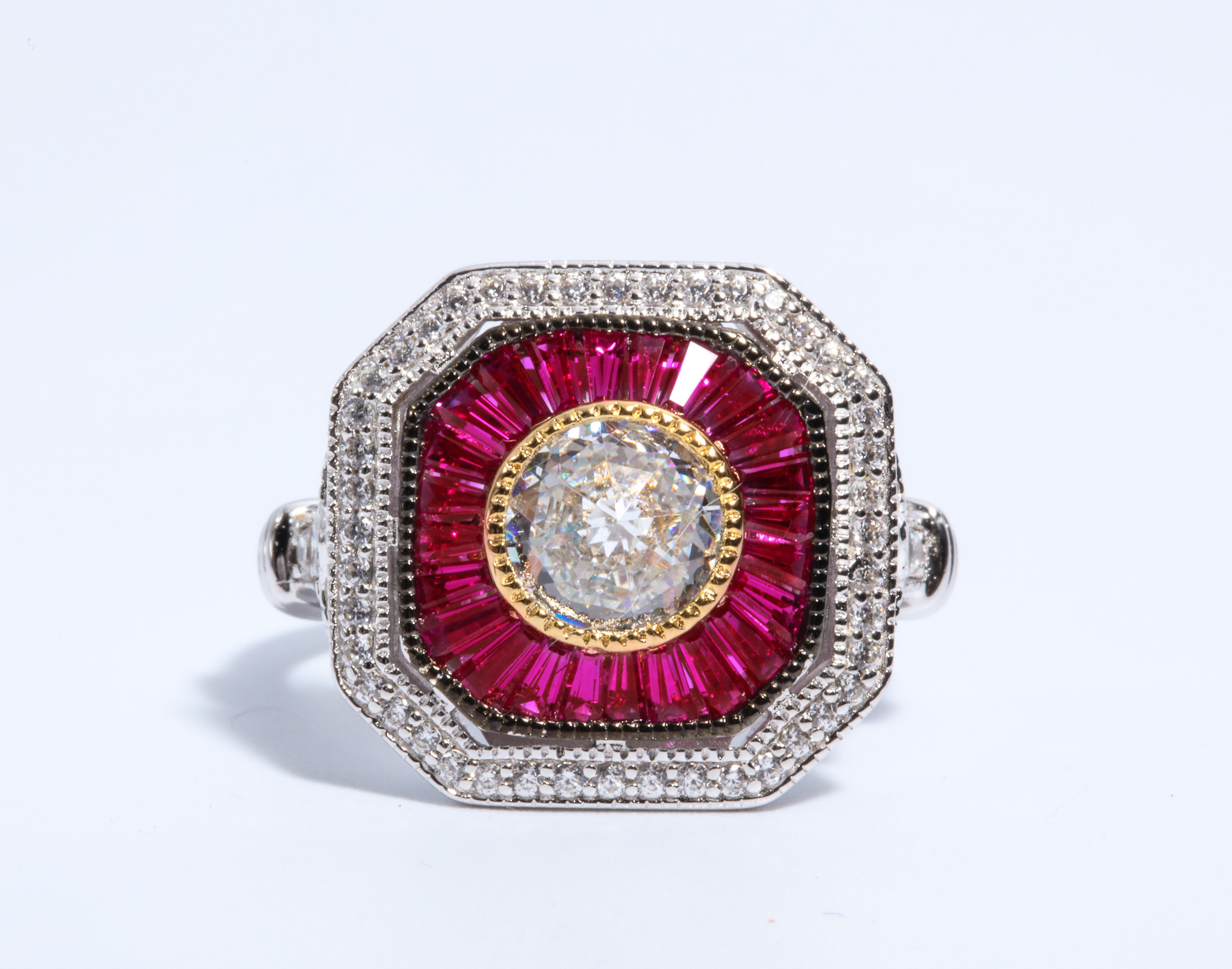 Magnificent Costume Jewelry Art Deco Style Diamond Ruby Sterling Ring set with a Round CZ Surrounded by Tapered Synthetic Baguette Rubies  set in non-tarnish Sterling free sizing.