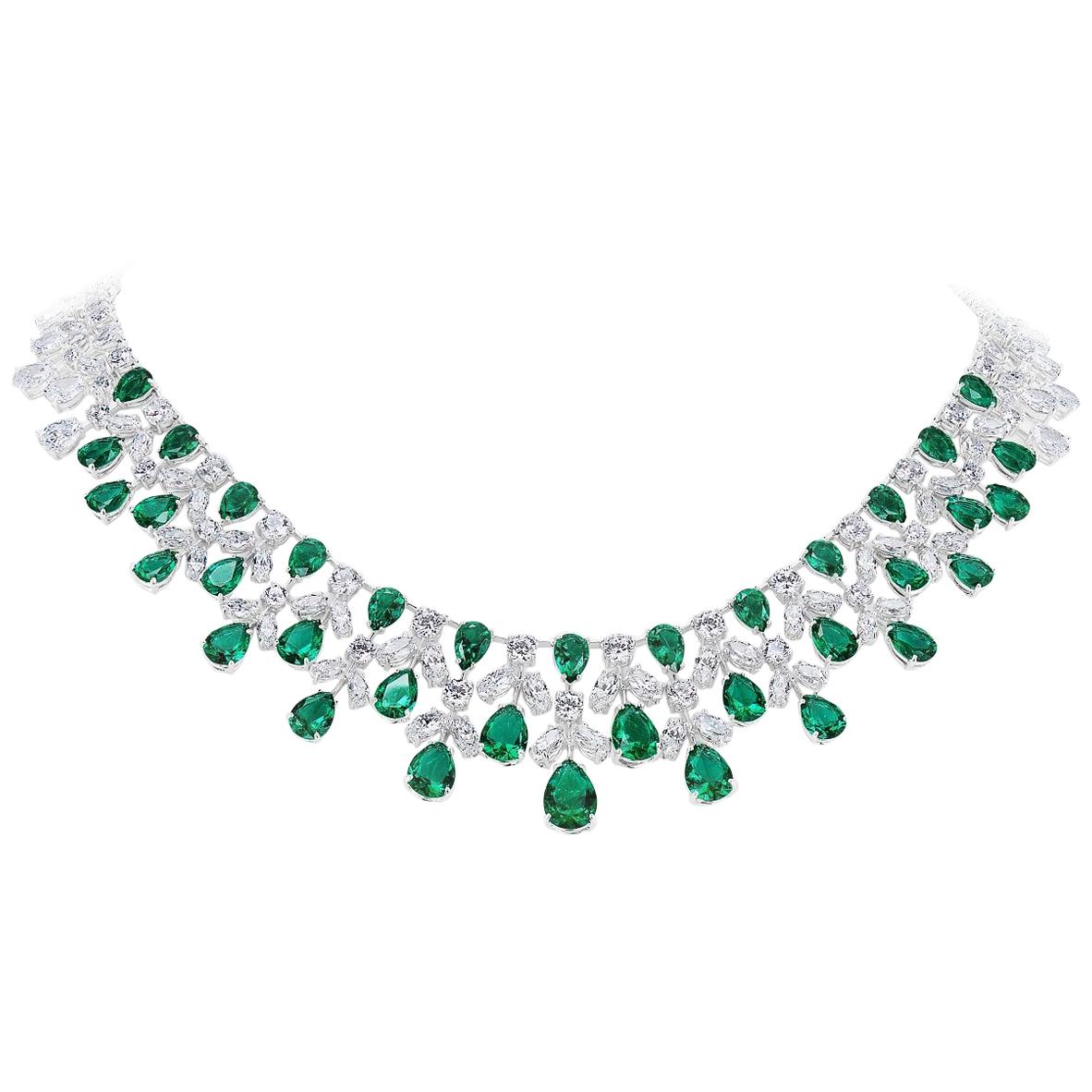 Magnificent Costume Jewelry Emerald Diamond La Grande Soiree Lace Necklace. Made with 35 Man-Made Pear Shaped Graduated 'Flawed' Emeralds; Marquise, Round and Pear Shaped Cubic Zirconias hand-set in Rhodium Sterling Silver measures 18 inches long by