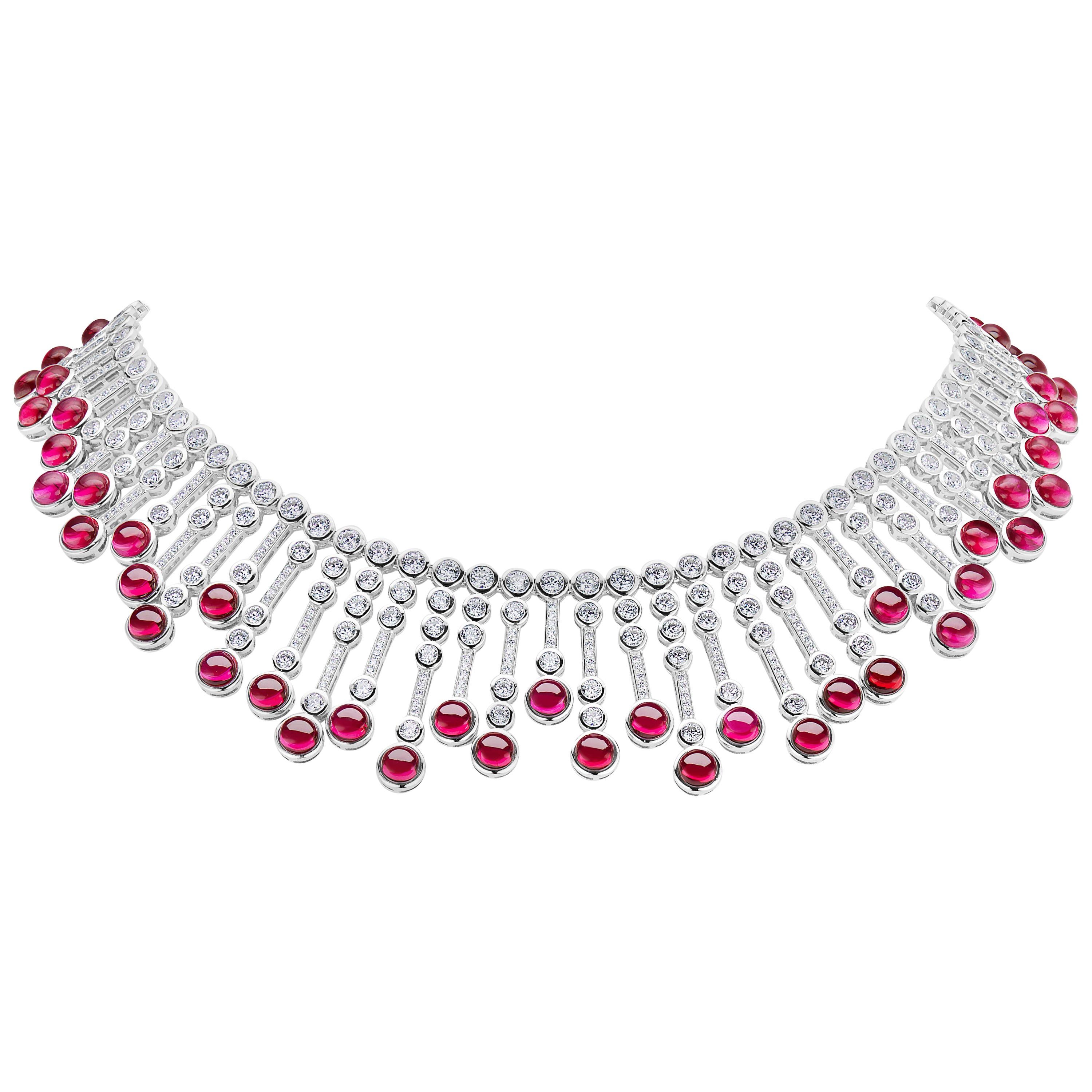 Magnificent Costume Jewelry Man-Made Cabochon Burma Ruby Diamond Fringe Sterling Silver Necklace of Alternating Gem Tipped Cubic Zirconia Set Bars Suspended from a Double Row Bezel CZ Set Sterling Silver Flexible Necklace measures 16 Inches.
