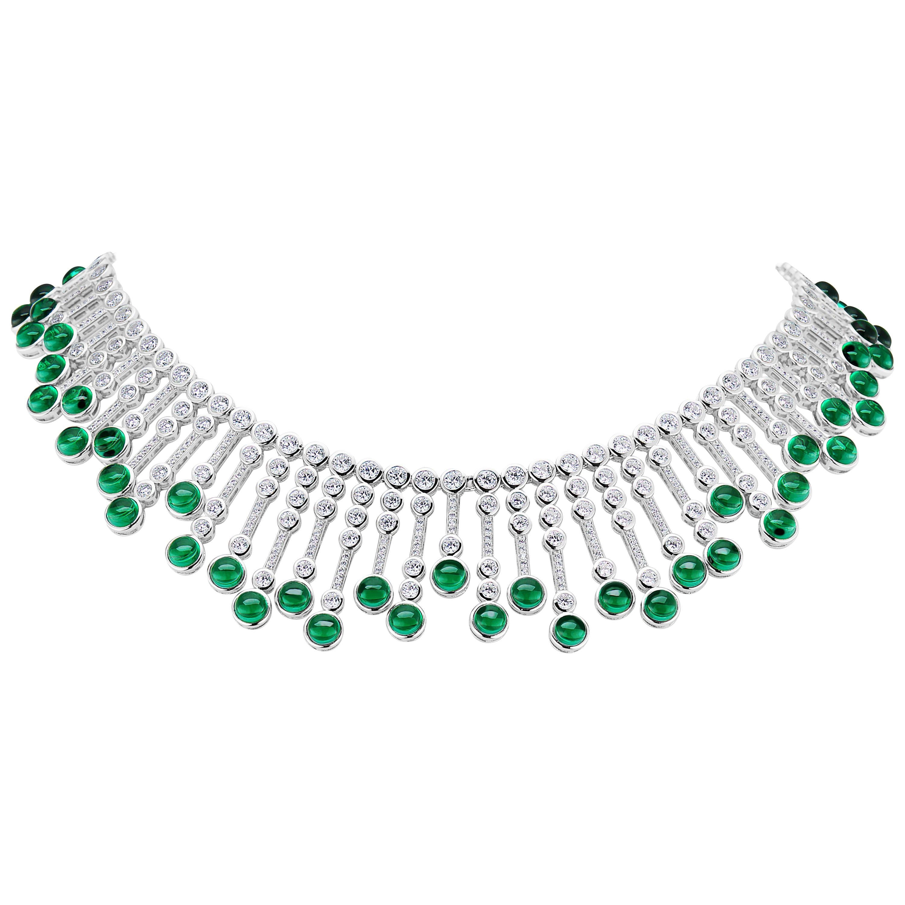 Magnificent Costume Jewelry Man-Made Cabochon Emerald Diamond Fringe Sterling Silver Necklace of Alternating Gem Tipped Cubic Zirconia Set Bars Suspended from a Double Row Bezel CZ Set Sterling Silver Flexible Necklace measures 16 Inches.