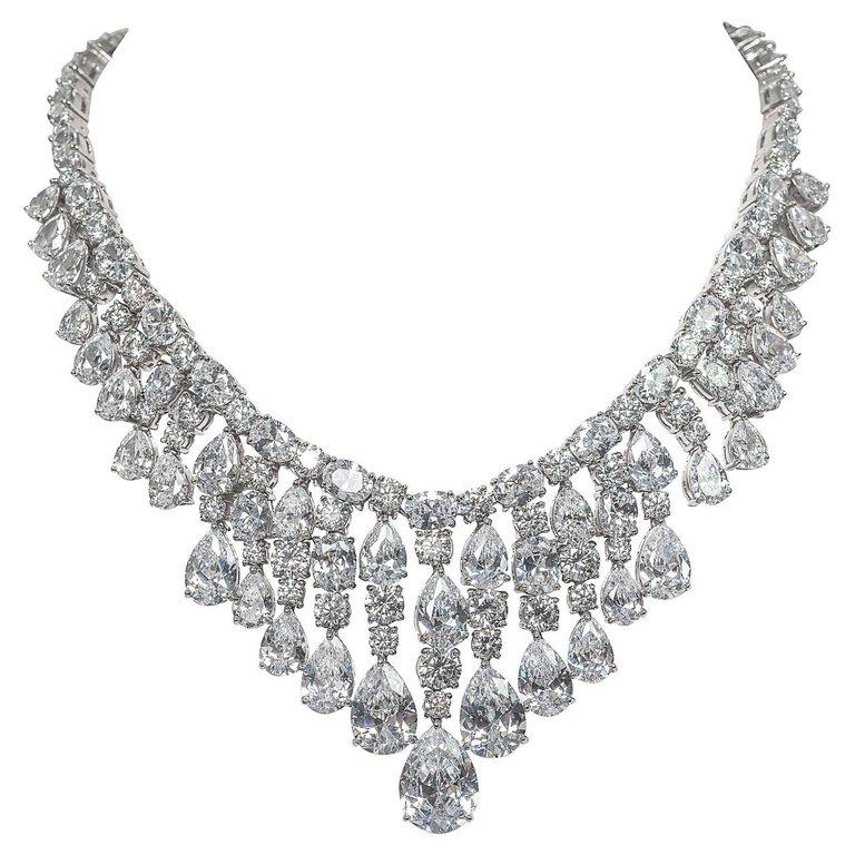 Magnificent Costume Jewelry  Fabulous hand made hand cut finest cubic zirconia hand set Red Carpet draperie fringe faux diamond necklace. Totally real looking shimmering elegance of brilliant fire.
Measures 16 inch neckline, the centre bib length is