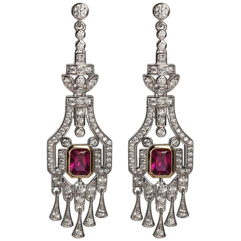 Wonderful faux ruby diamond earrings of synthetic stones hand set in sterling silver in the manner of the elegant Art Deco period. Superbly well made.
Measure 2 1/4 inch long by 3/4 inch wide with post fitting.