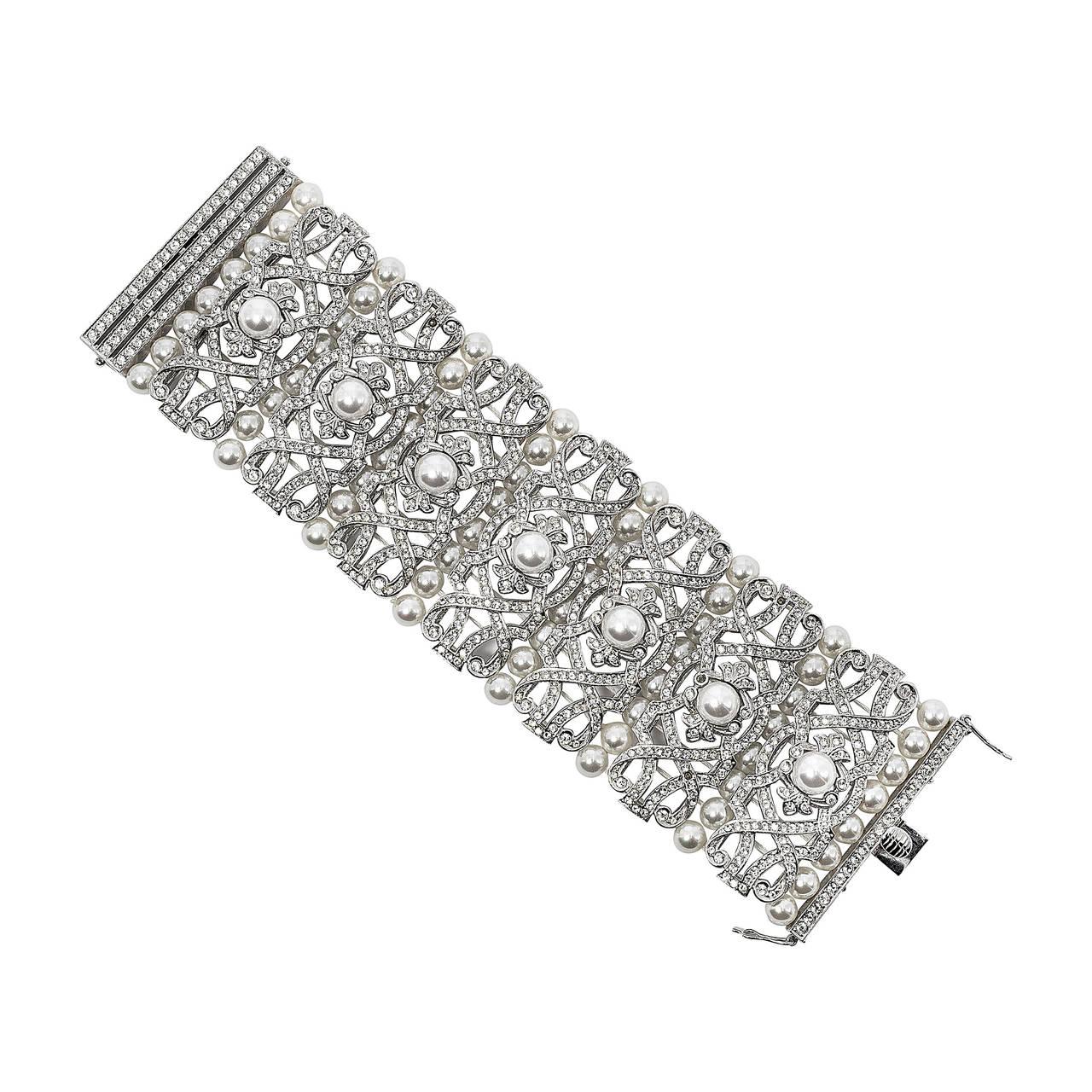 Fabulous wide Art Deco Style faux diamond pearl sterling bracelet of amazingly intricate work. Handmade and in mint condition, never worn. Unique and rare belonging to an archival collection of magnificent costume jewels. measures 7 inches long and