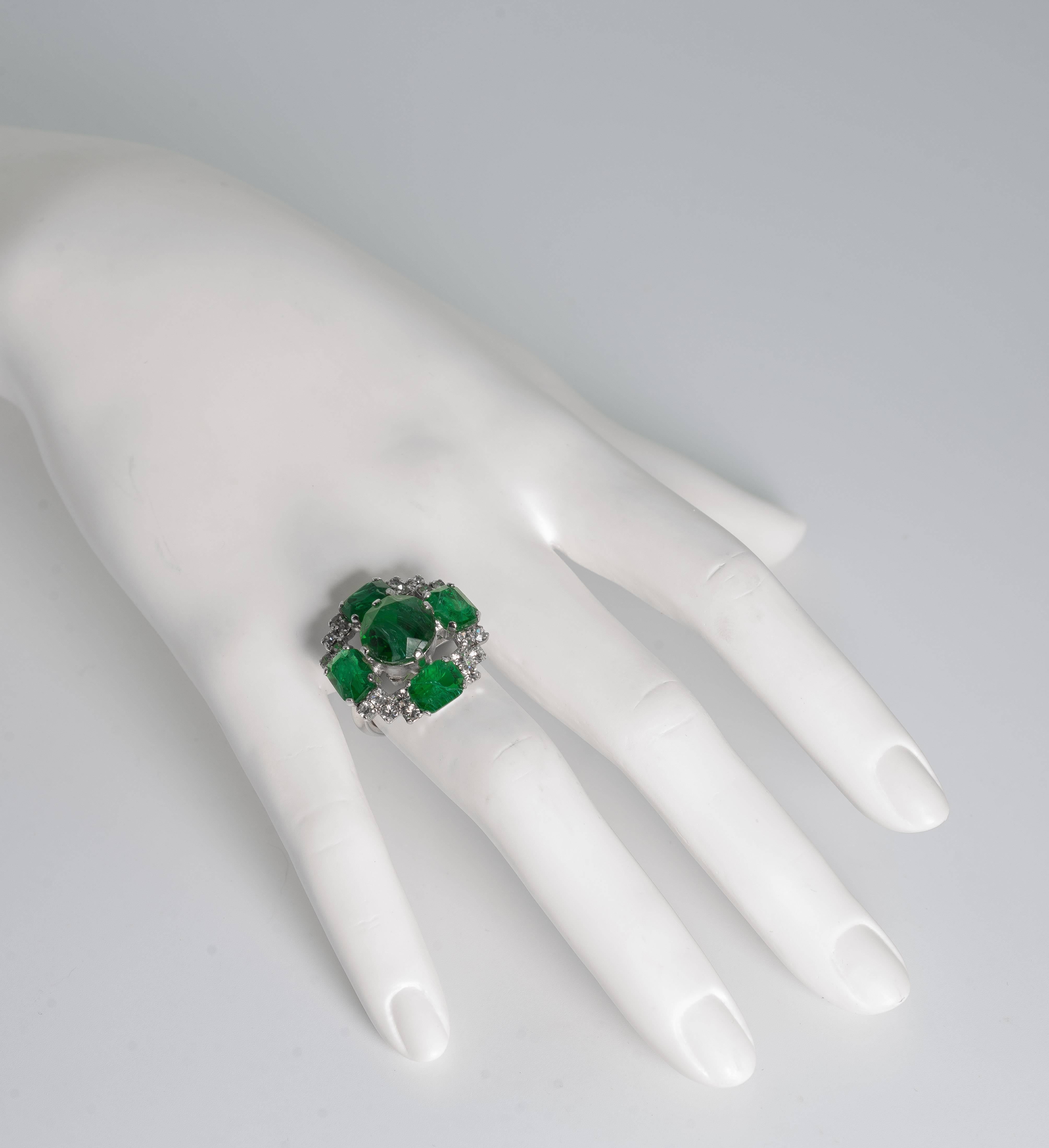 A 1960s Christian Dior faux emerald diamond ring set with Dior's famous 'flawed
emeralds''. Christian Dior designed a very popular faux emerald yet expensive collection in the 1960s. The original cost in 1968 was equivalent to-day $400.

Ring