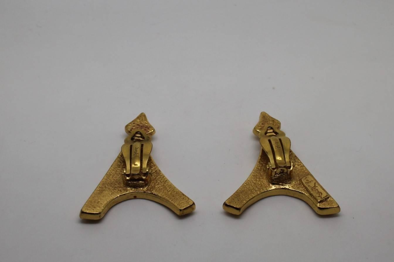 YSL Earrings representing the Eiffel Tower. Signed in the back. Good condition for a vintage piece but it has some small signs of wear