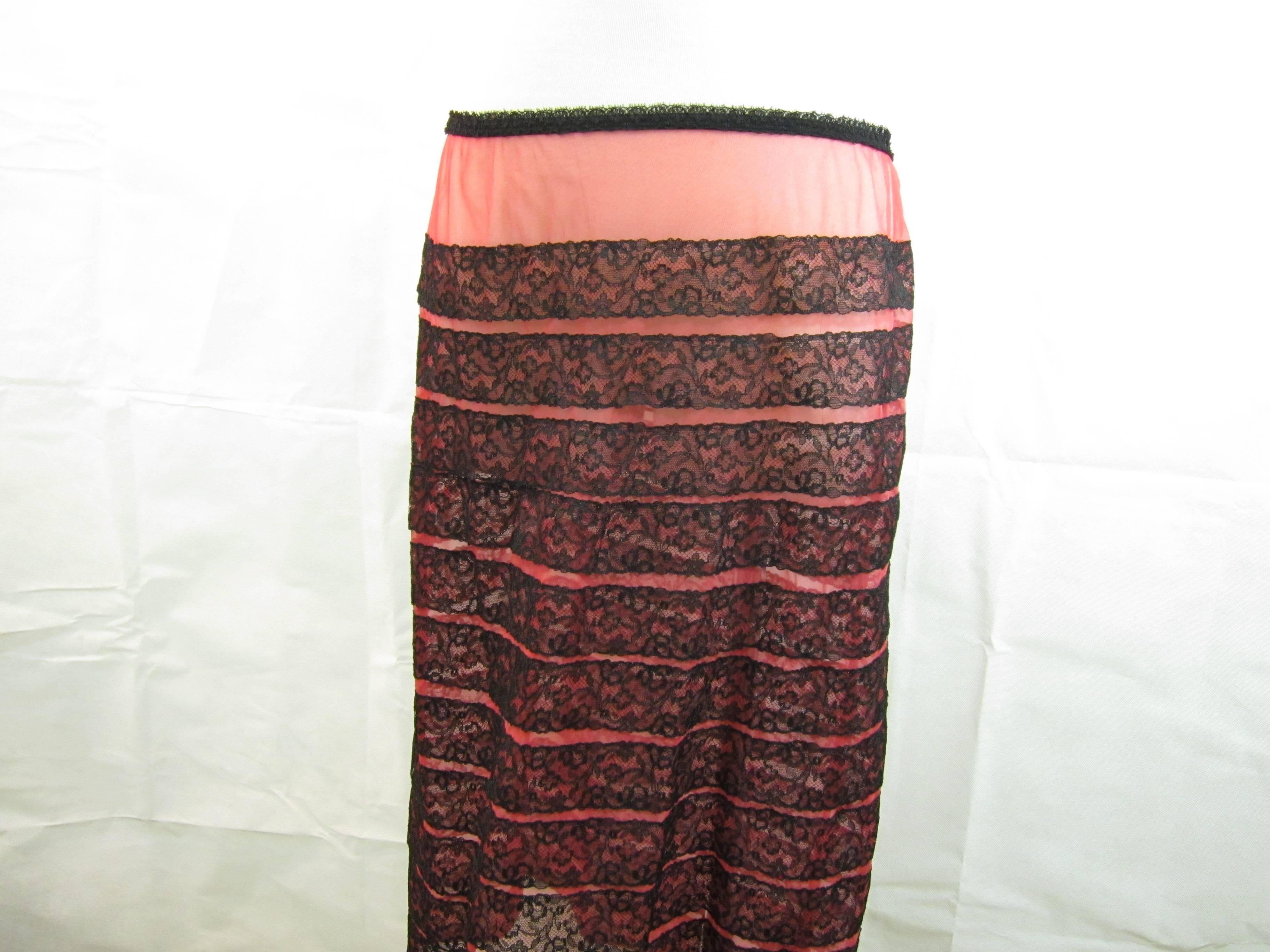 Schiaparelli cintage underskirt in pink and black nylon. Quite transparent and super sexy. Hard to say for the size as it is elastic but would fit from a 40 to more.