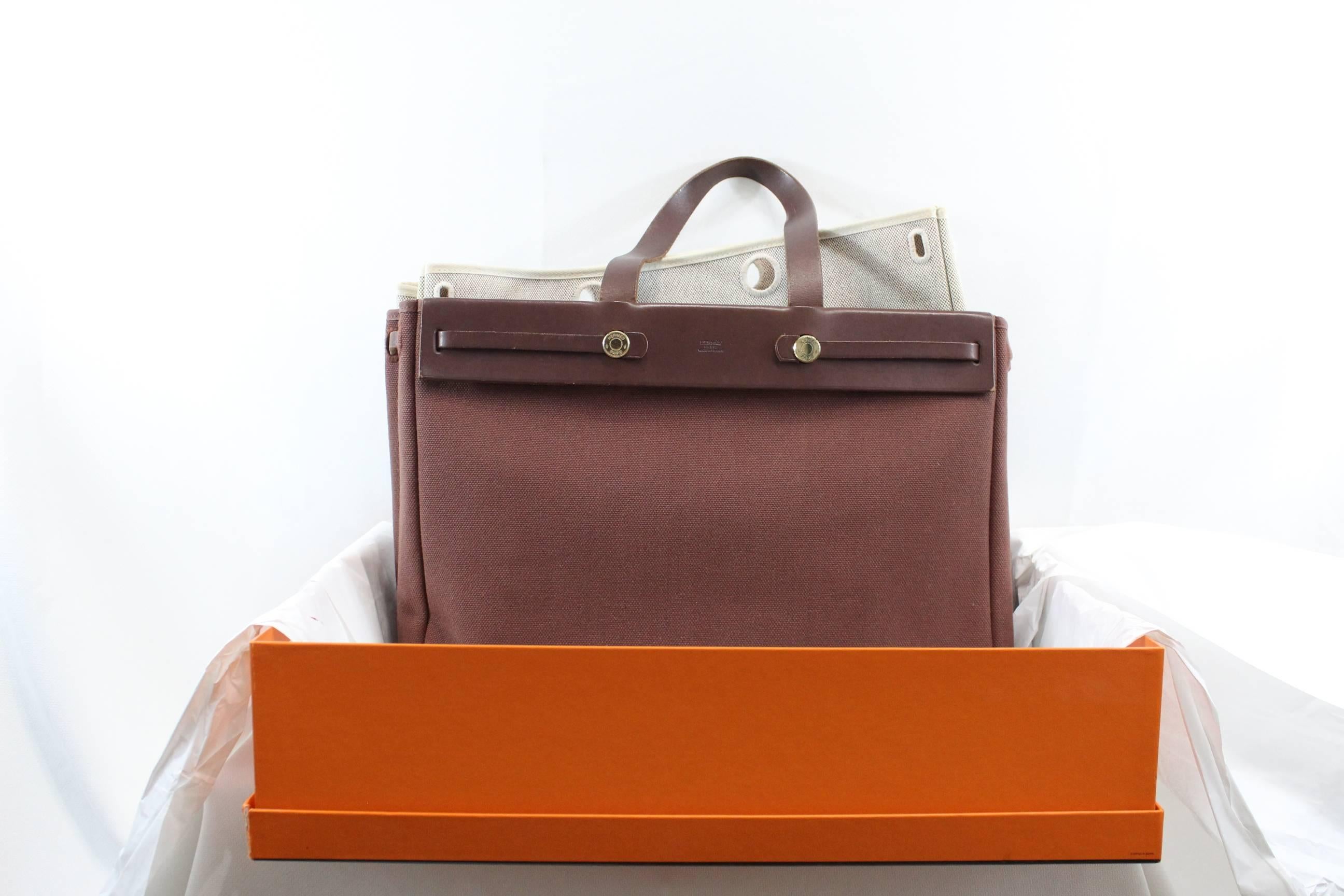 Hermes Herbag GM (16x11,5") in brown chocolate canvas and beige canvas for the smaller tote.Brown leather.Good condition  but some signs of wear.Small stain in the beige canvas (small tote) and inside. Chocolate canvas in really good condition.