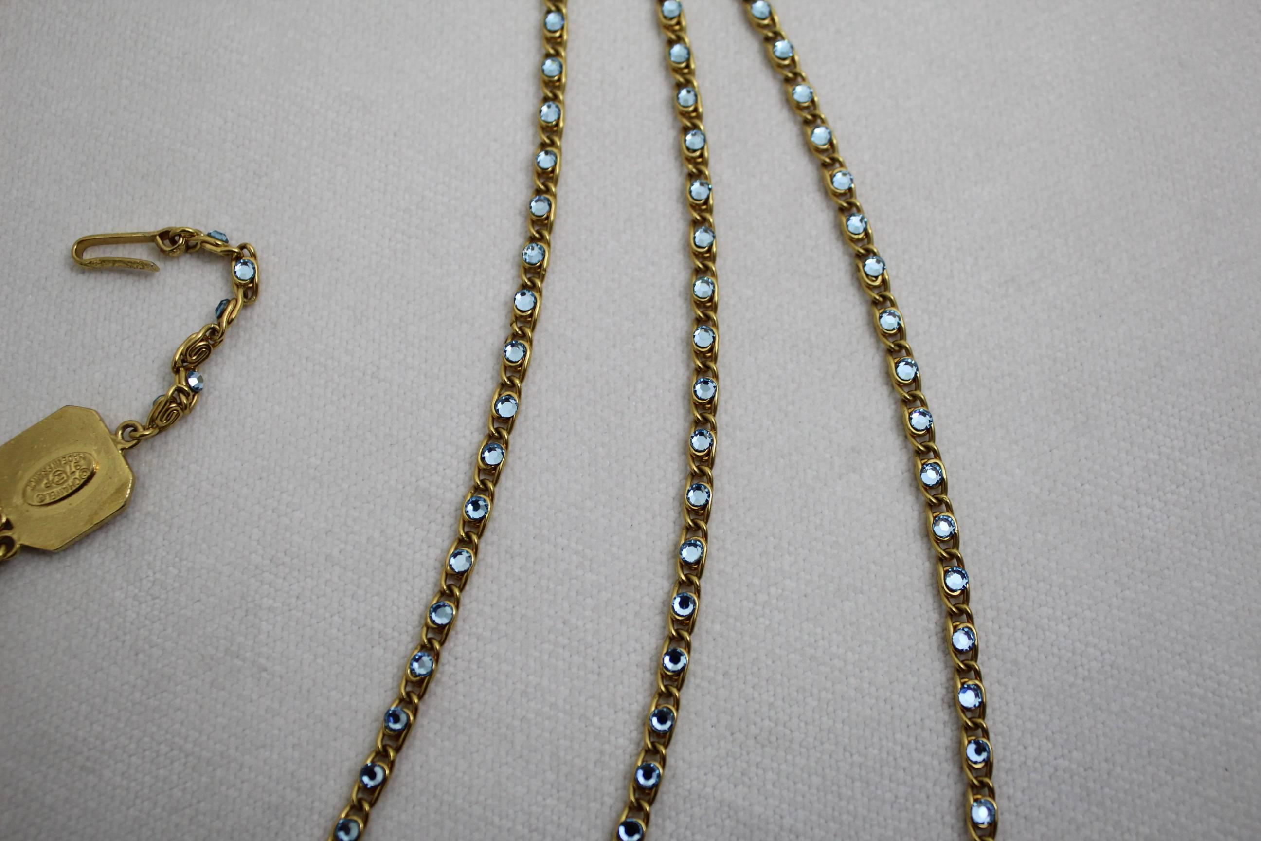 Sophisticated 1997 Chanel Necklace with blue stones and gold plated metal. 1