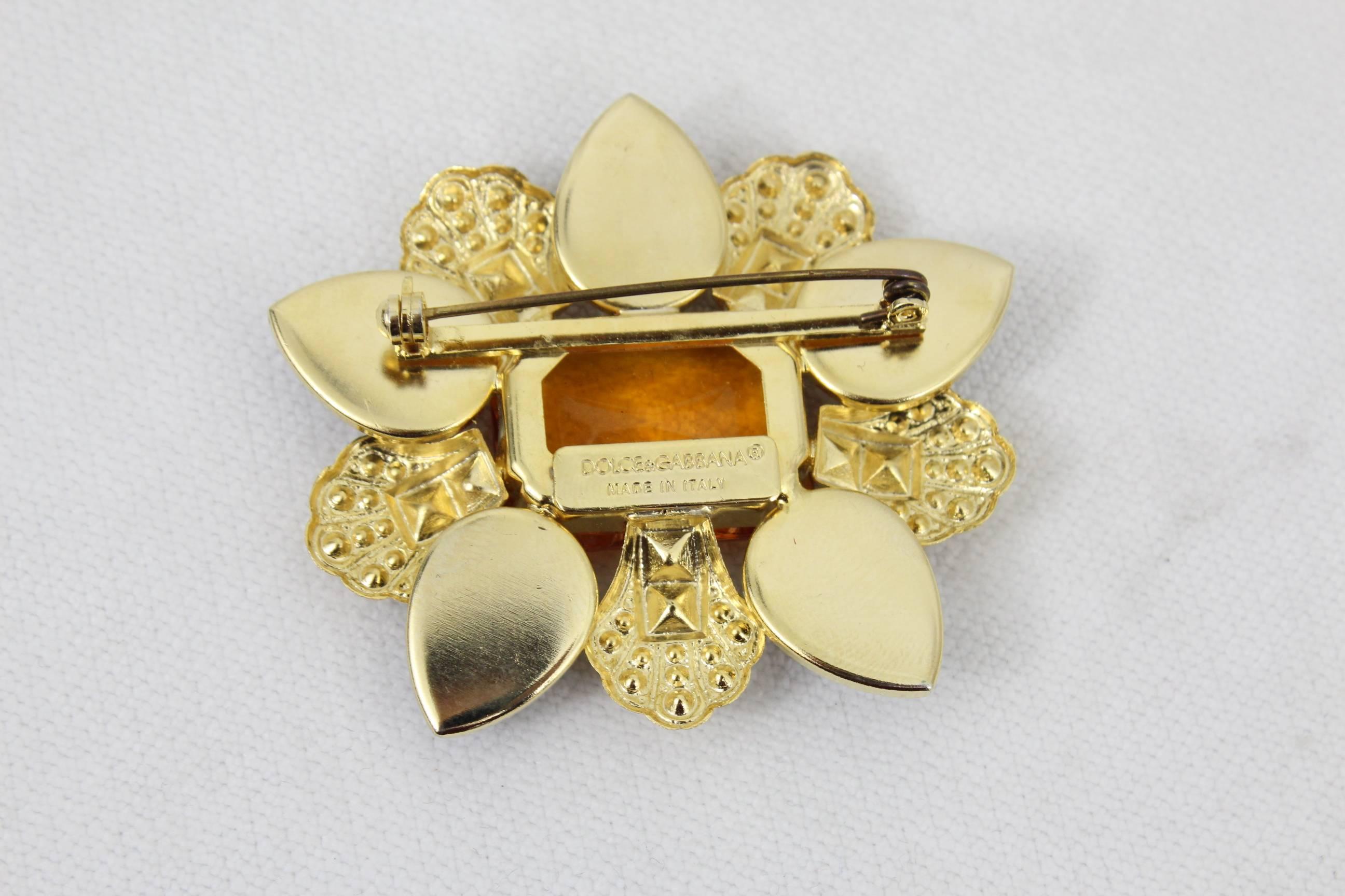 Nice brooche for men fom Dolce Gabanna in golden steel and stones. eally nice to complete your look