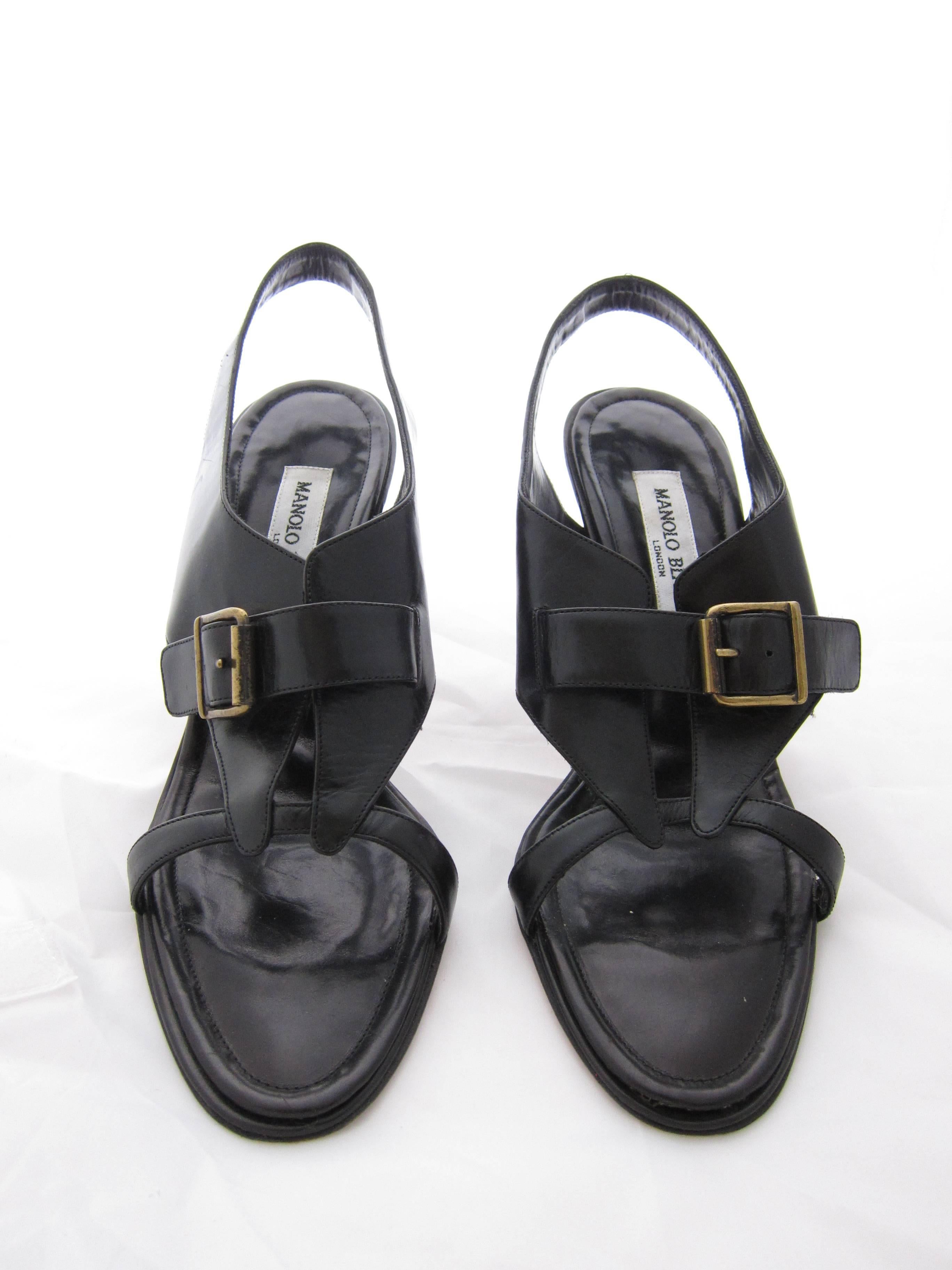 Really nice Manolo Blahnik Black Leather Sandals in blakc leather an 
d brass hardware.

Size Us 7 (french 38 and a half)

Good condition. Some light signs of wear