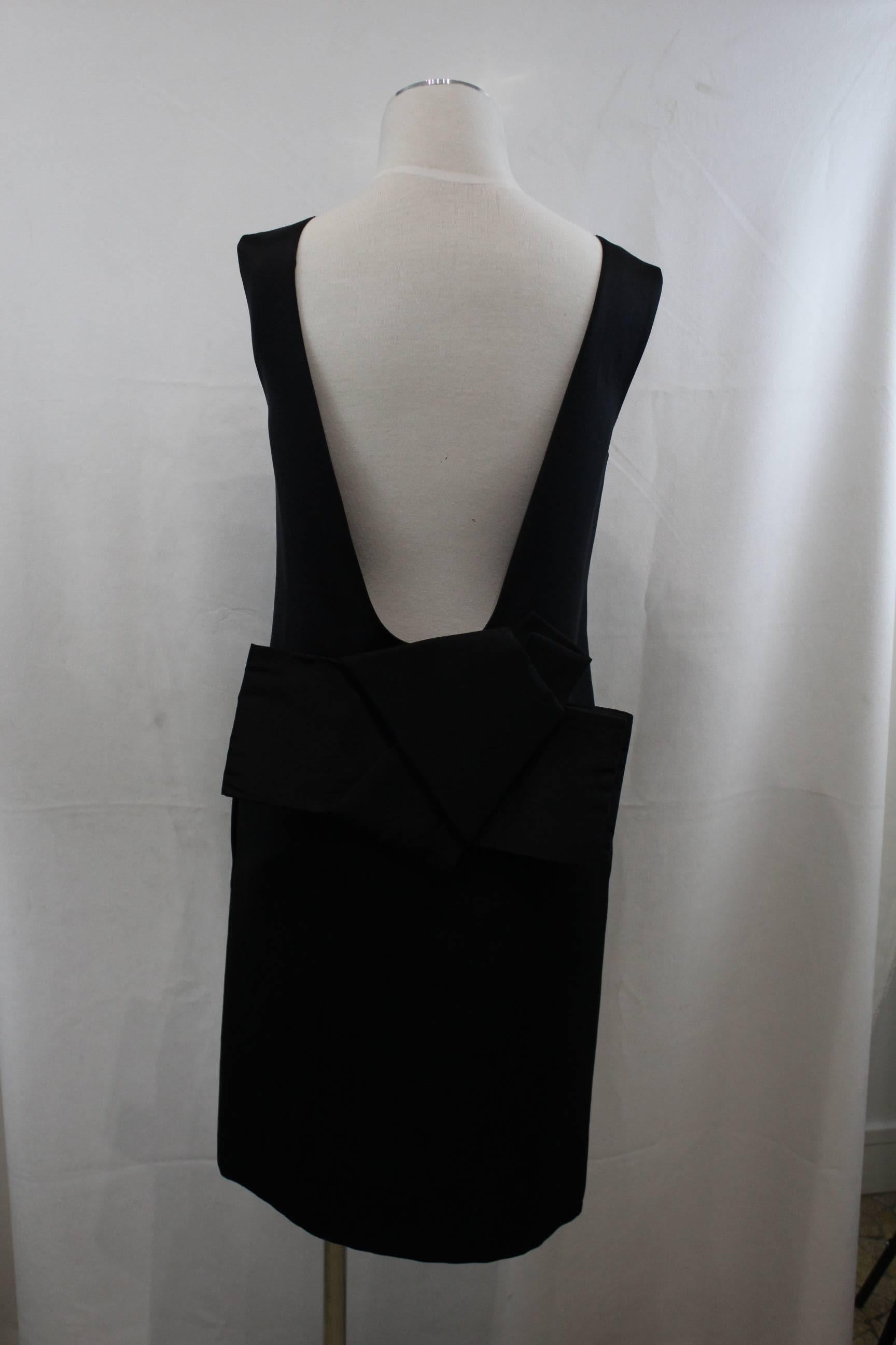 Awesome black cocktal dress from lanvin 2006 summer colelction.

Almost naked back with a maxi ribbon.

really god condition
