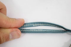 Hermes Silver Dog Whistle Necklace with blu leather