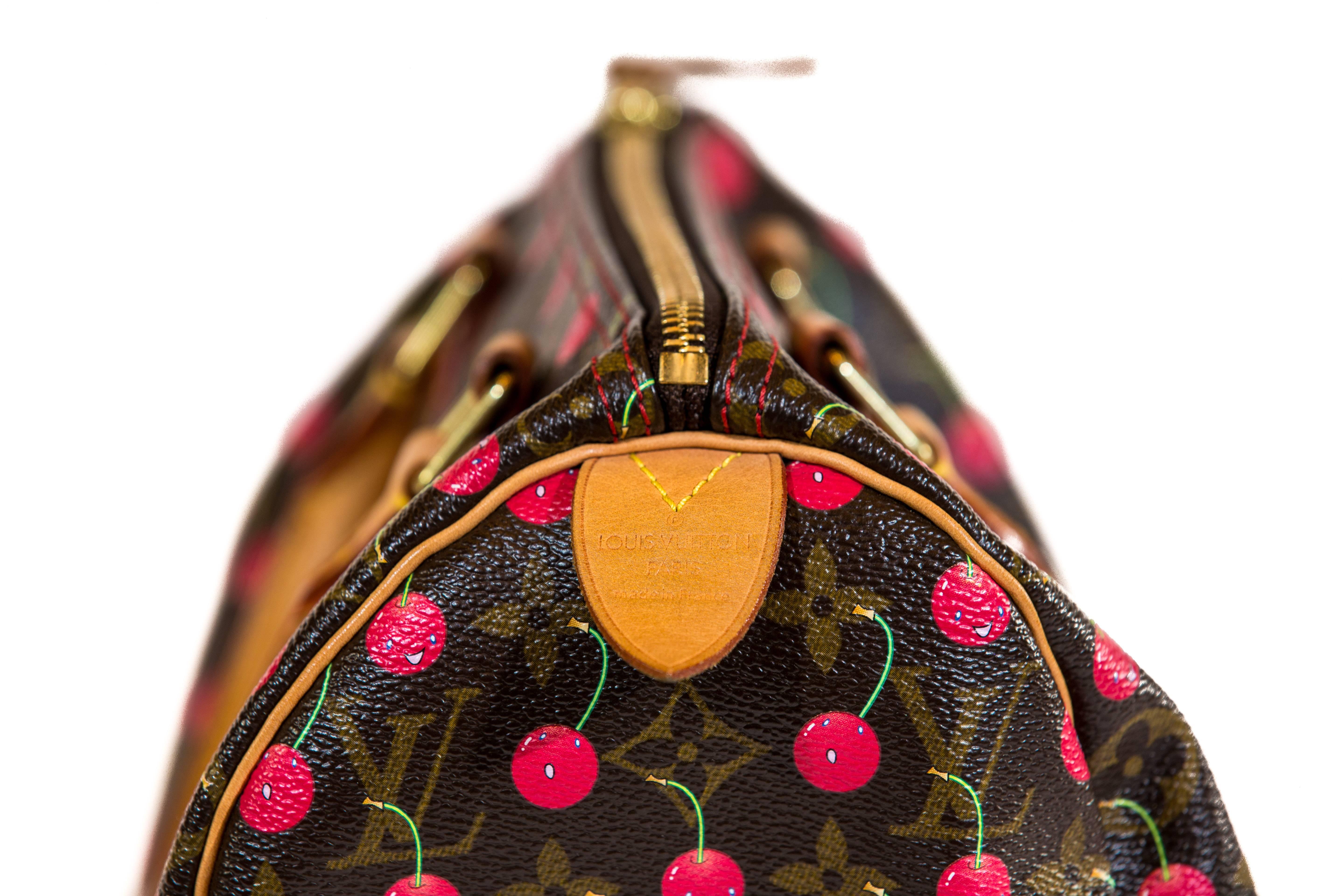 Own the coveted Louis Vuitton Speedy Handbag 25 - Limited Edition Cerises - from the 2005 Spring collection. Japanese pop artist Takashi Murakami wowed fashion lovers with a red cherry print over Louis Vuitton's classic brown monogram canvas print.