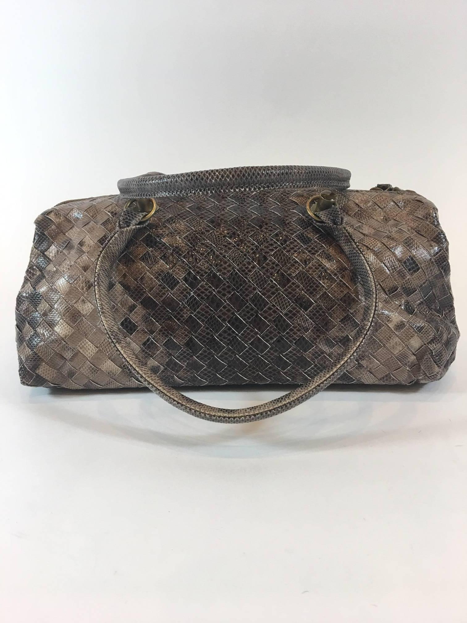 Fall in love with this Bottega Veneta brown lizard leather Karung Vohdo East/West satchel handbag. Gold-tone hardware, dual rolled snakeskin top handles (7