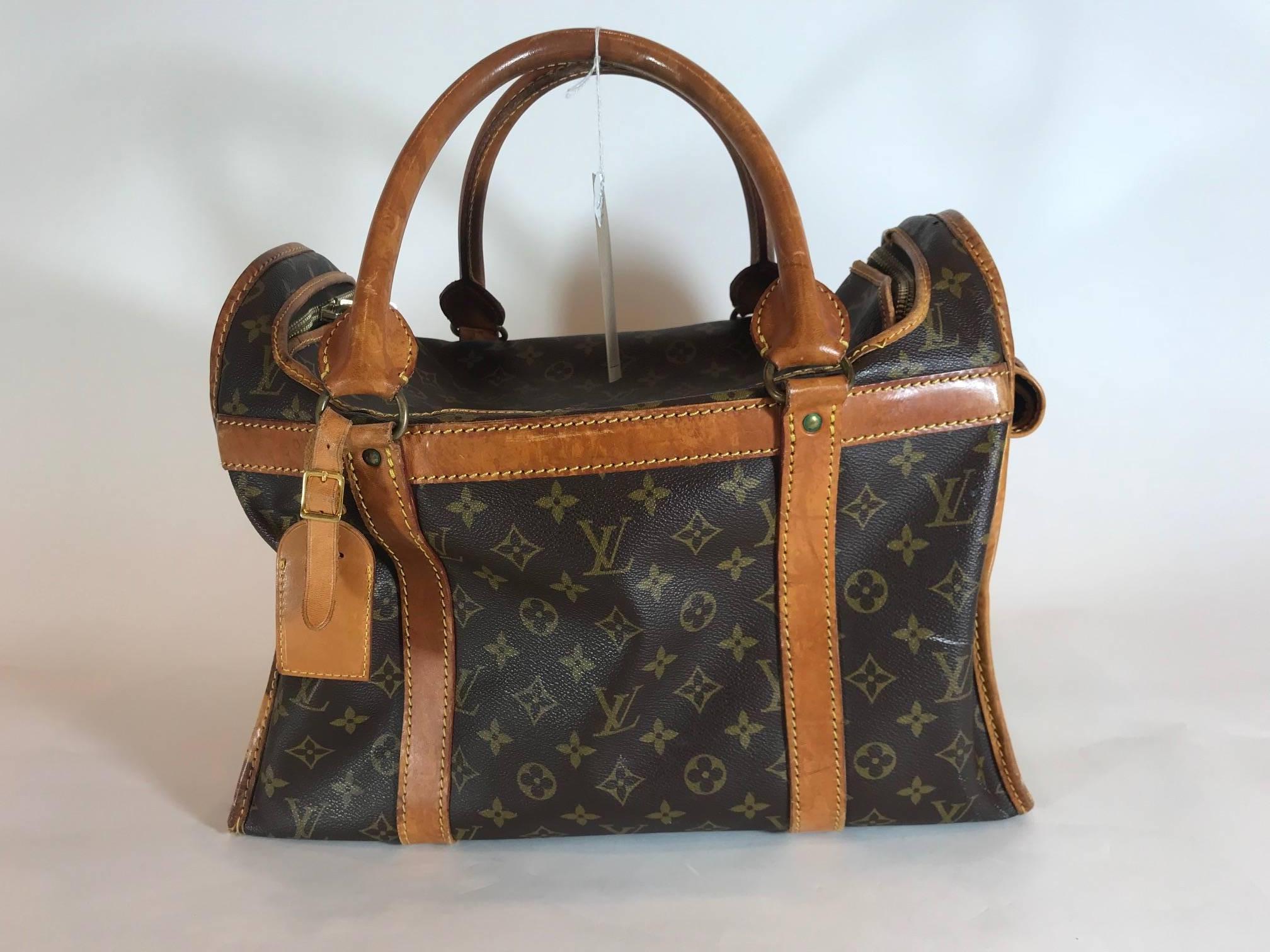 Signature monogram canvas featuring  natural cowhide leather trims. Gold-tone hardware. Gold-tone breathable mesh window. Dual top rolled handles. Roll-up flap with snap fastener. Top-zip around closure. Water-resistant brown nylon interior. Lock