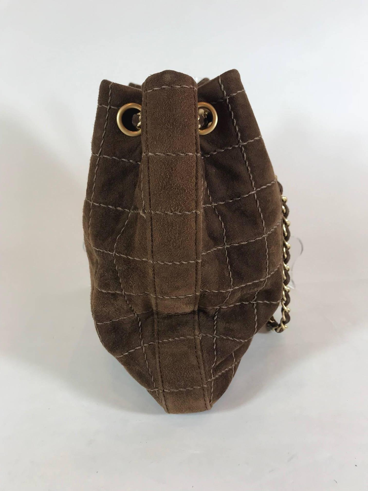 Brown quilted suede. Gold-tone hardware. Dual chain link shoulder straps. 