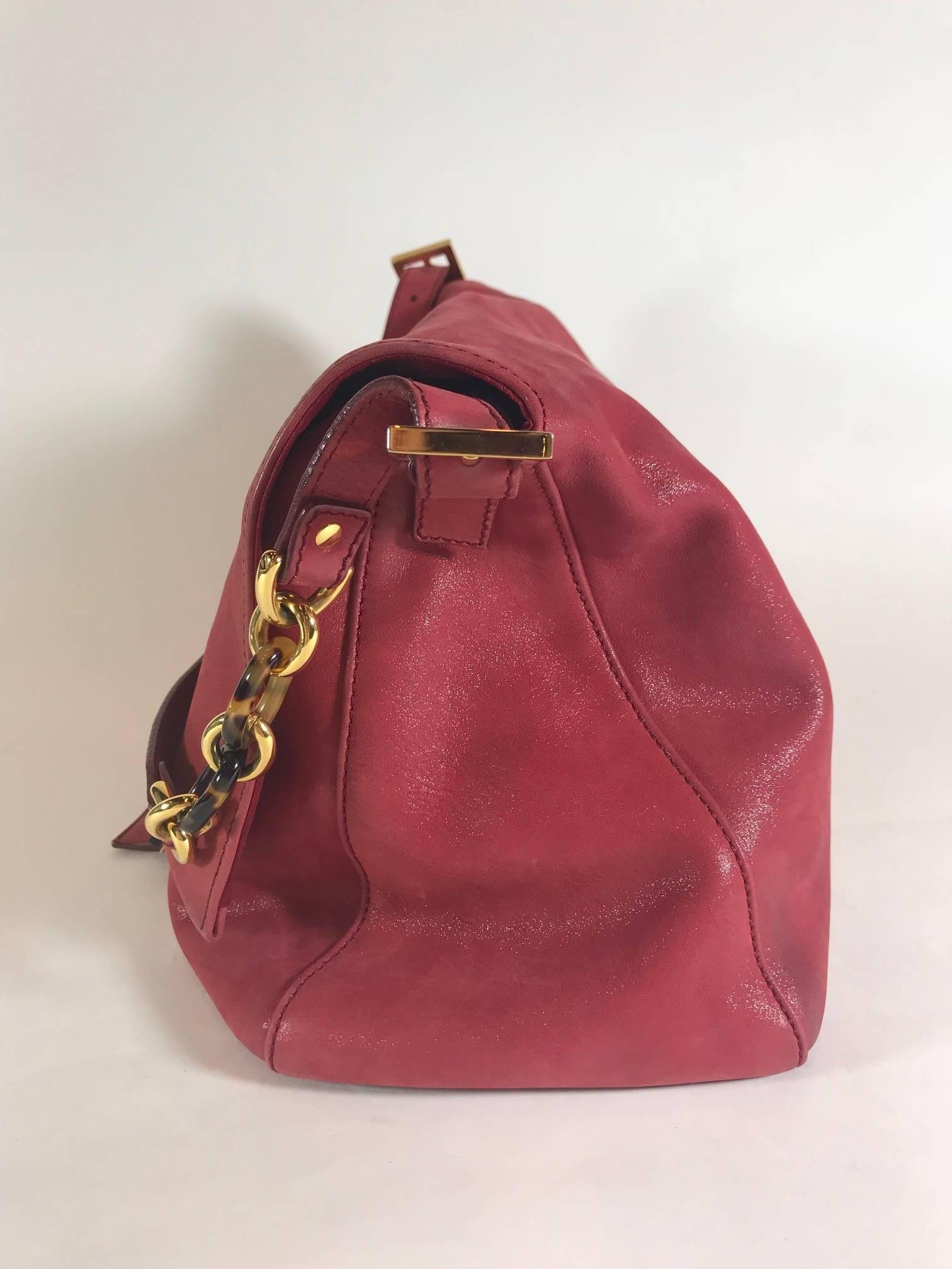 Raspberry shiny leather. Gold-tone hardware. Front flap and Ceramic 