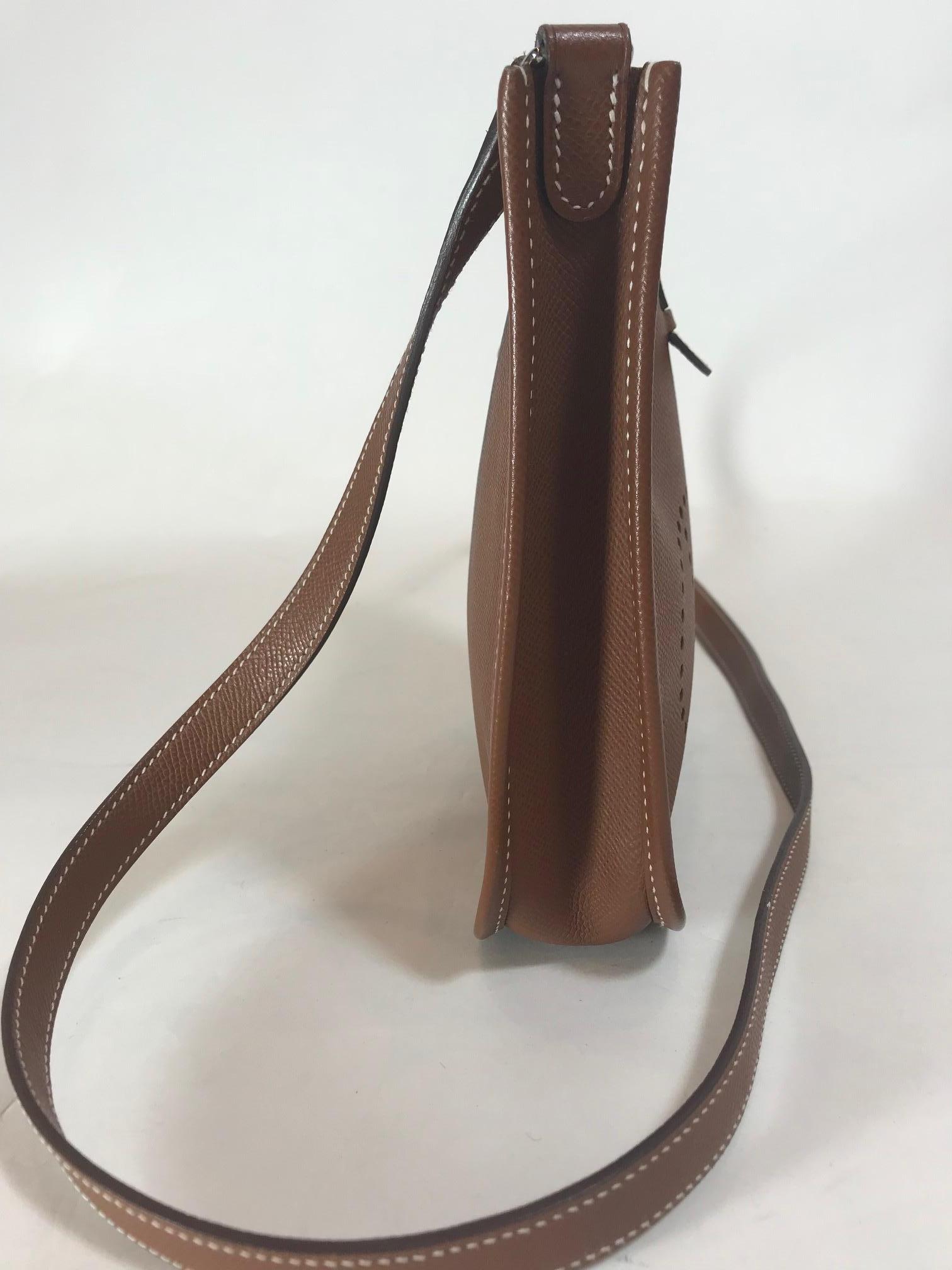 Hermes brown courchevel. Palladium-plated silver hardware. Snap closure at back. Single flat shoulder strap. Perforated logo at front. Tonal hide interior and snap closure at back. Blind stamped Square 