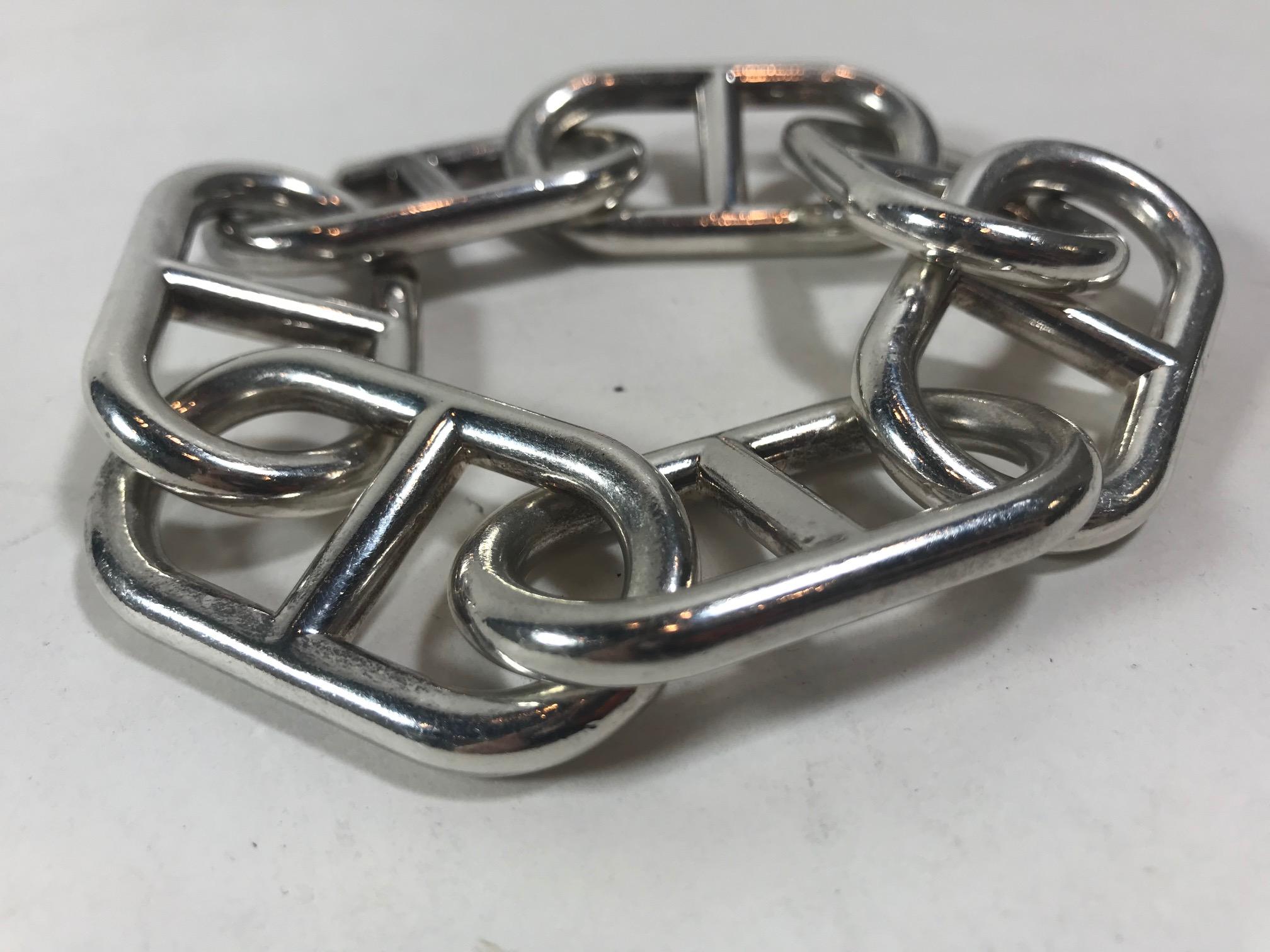 Rare vintage linked bracelet. 7 large metallic sterling silver links. Hidden slip-on slip-off closure within links. Circumference: 11 inches Retail Price: 3,050