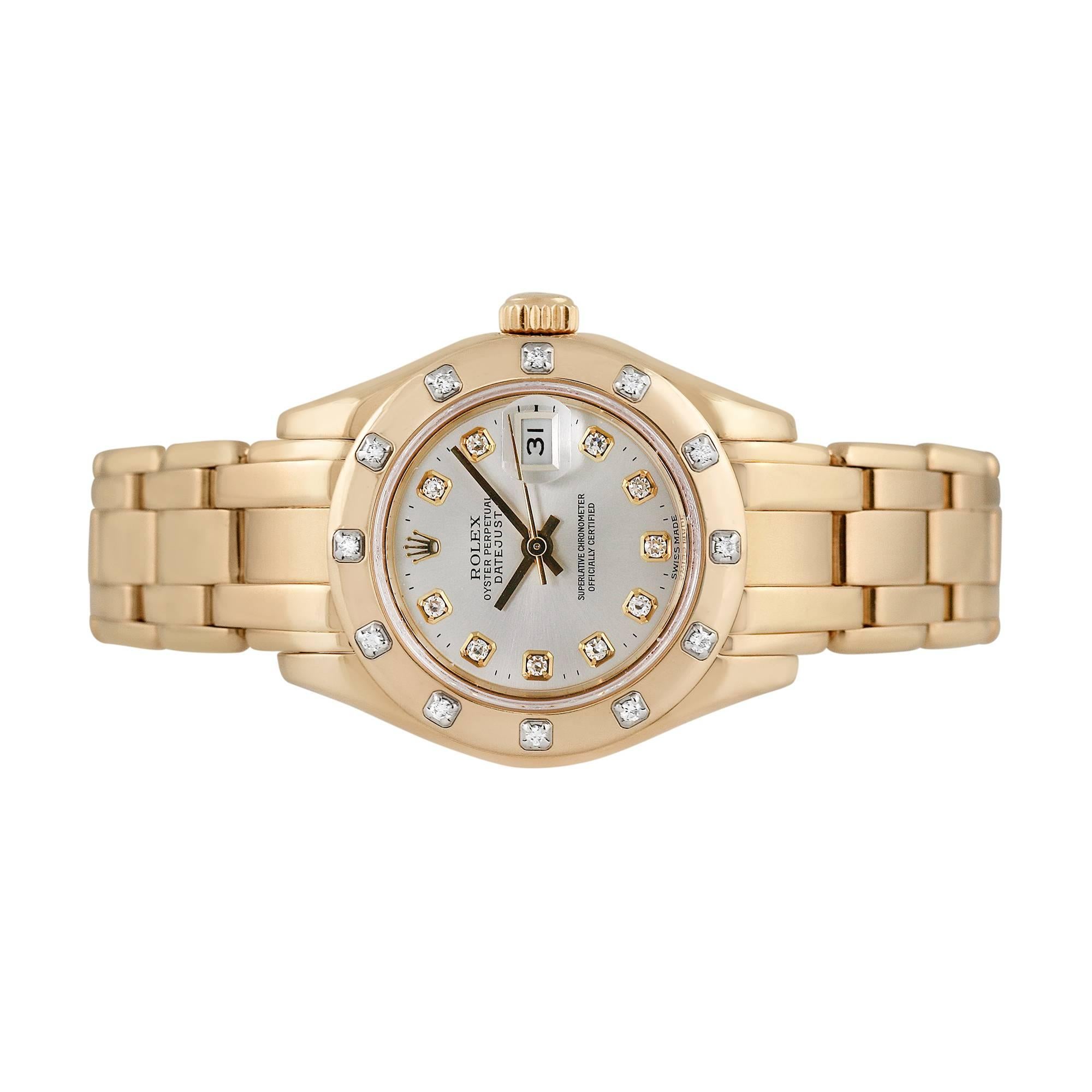 Rolex Ladies Pearlmaster wristwatch with diamonds, reference 69318, circa 1990. This exquisite Rolex features an 18 karat yellow gold 29mm case and bezel that is punctuated with diamonds and 18 karat yellow gold Pearlmaster bracelet. The movement of