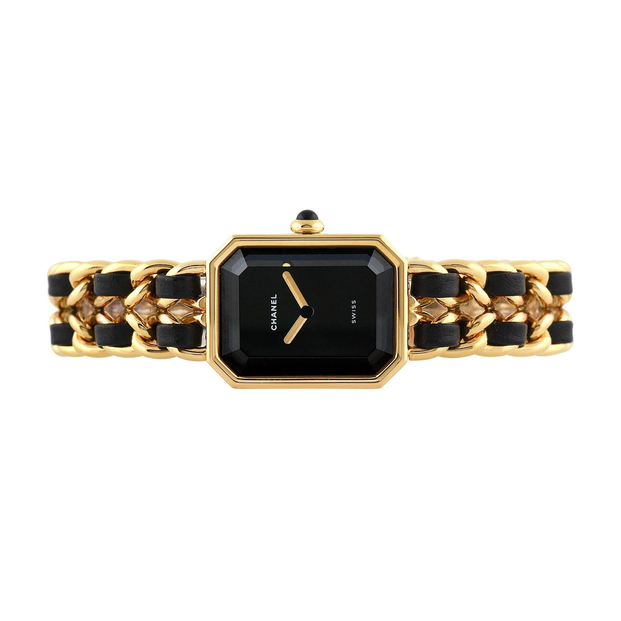 Chanel Premiere ladies wristwatch, ref H0001, circa 1980. With 26mm x 20mm case diameter gold filled and gold filled bezel with quartz movement. 30m water resistant. The bracelet is gold filled and leather, with deployment clasp, black dial color,