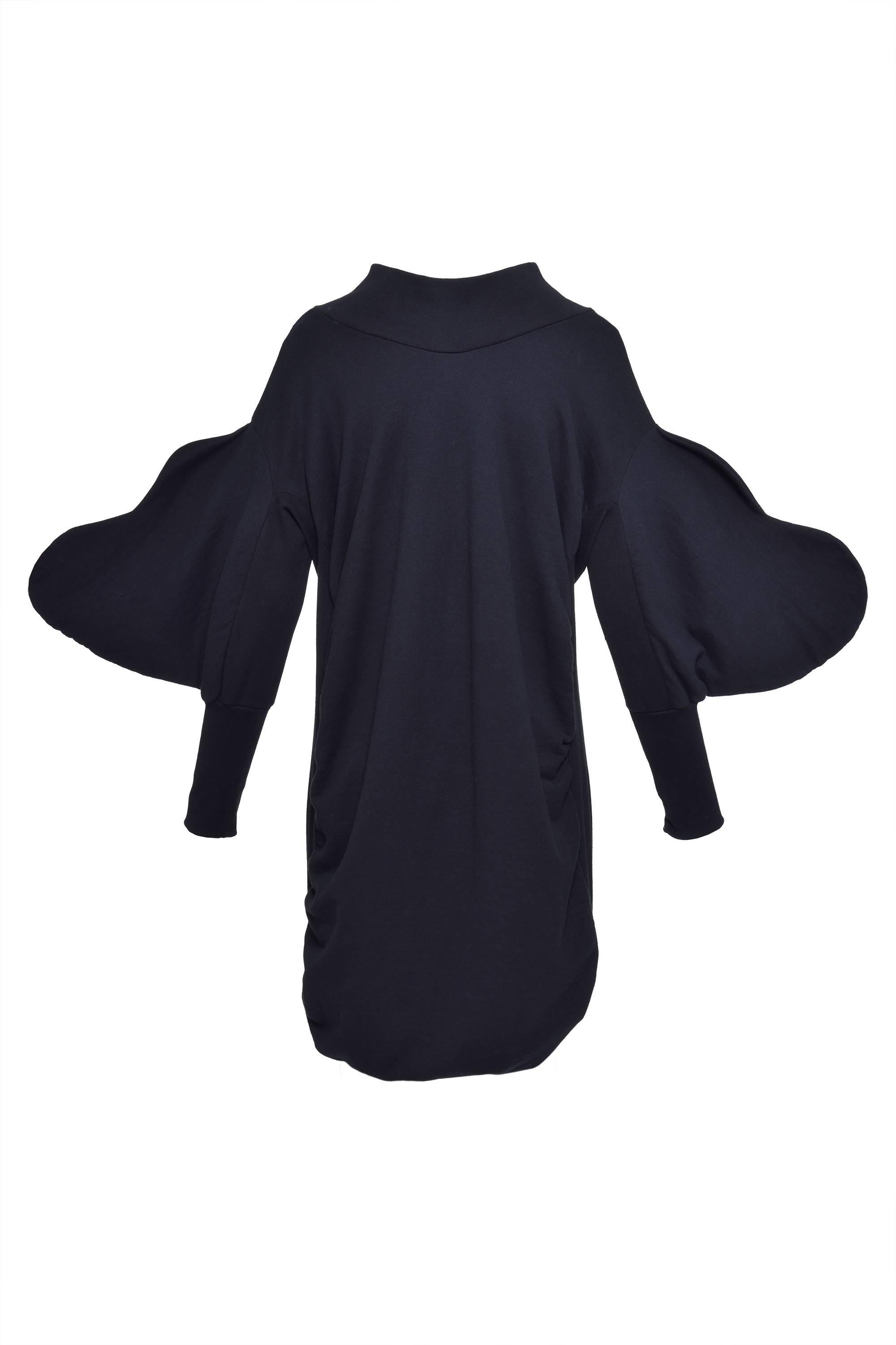This gorgeous Limited edition designed by Bernhard Willhelm for 10 CORSO COMO Milan Sweater dress is in dark blue sweatshirt cotton with draped sides, v neckline and hearts sleeves and balloon skirt.  

Excellent Condition 

Label: BERNHARD WILLHELM