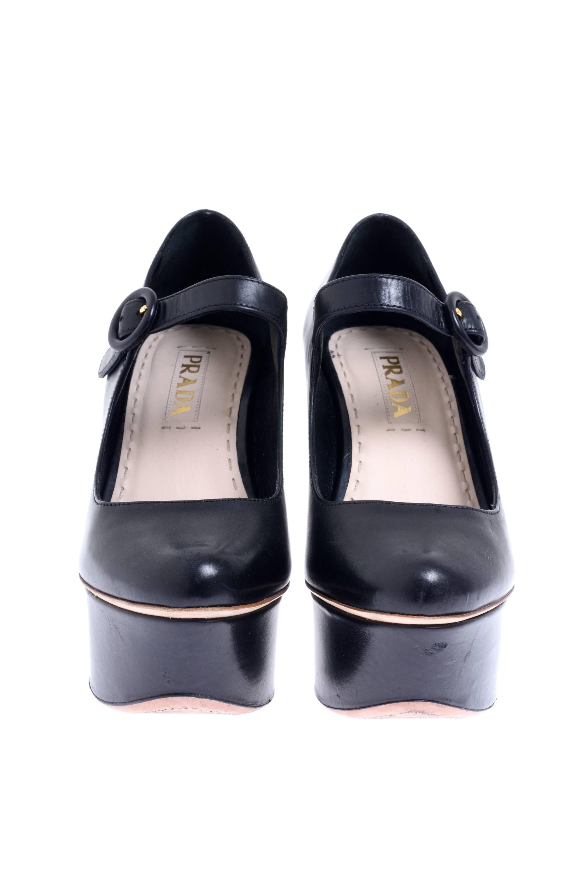 2011 SS PRADA Black leather shoes Mary Jane with visible high heel and platform separated with a decorative nude line, nude insole and sole with decorative sewing and ankle adjustable strap with circular buckle closure. 

Excellent Condition