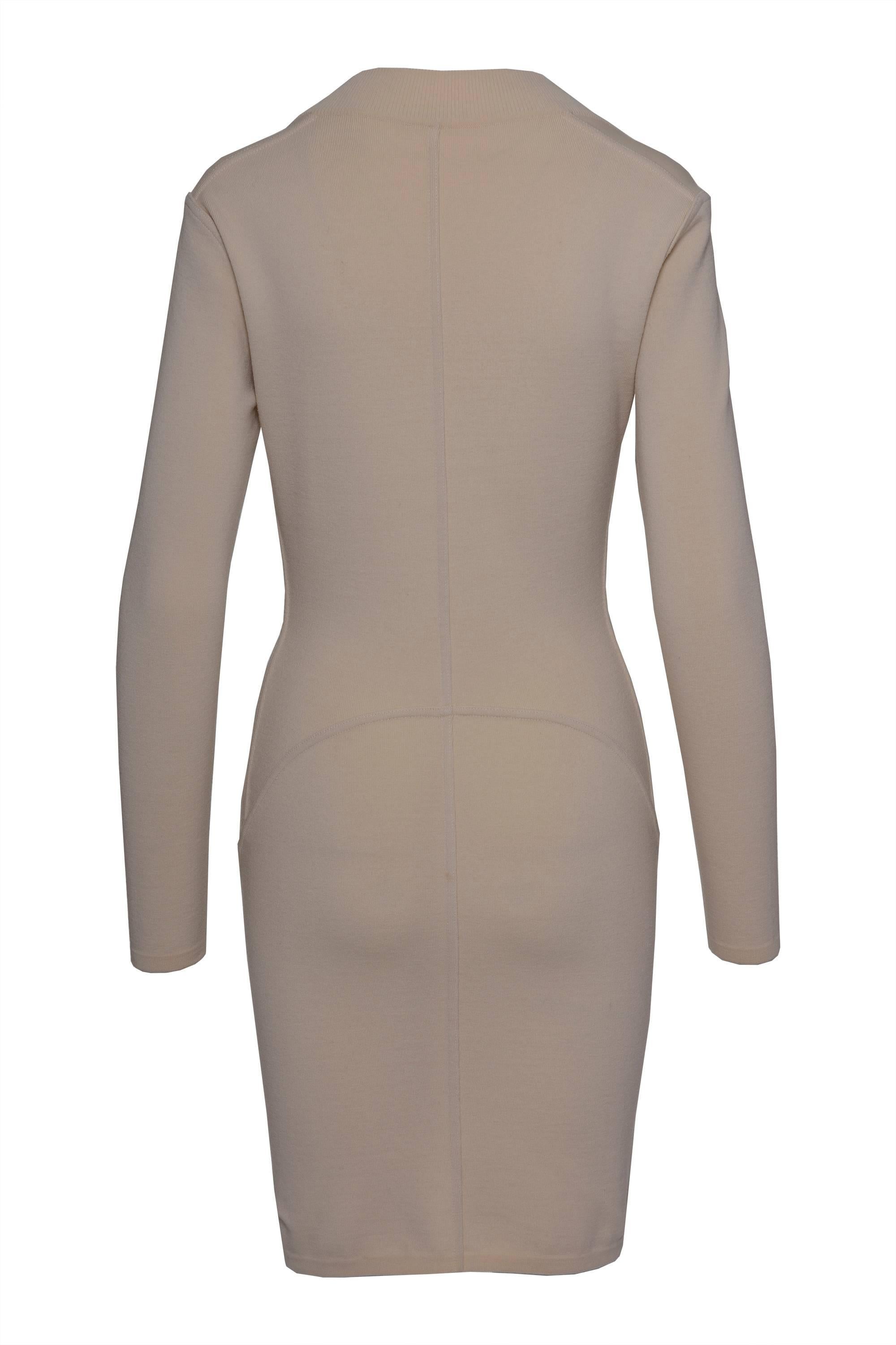 ALAIA Nude sweater dress has a trapezoidal off-the-shoulder neckline, with organic frontal cuts, long sleeves, nude color, and pencil skirt. Made in Italy.

Excellent condition

Label: ALAIA Paris Made in Italy
Label size: M IT
Material: 86% Wool