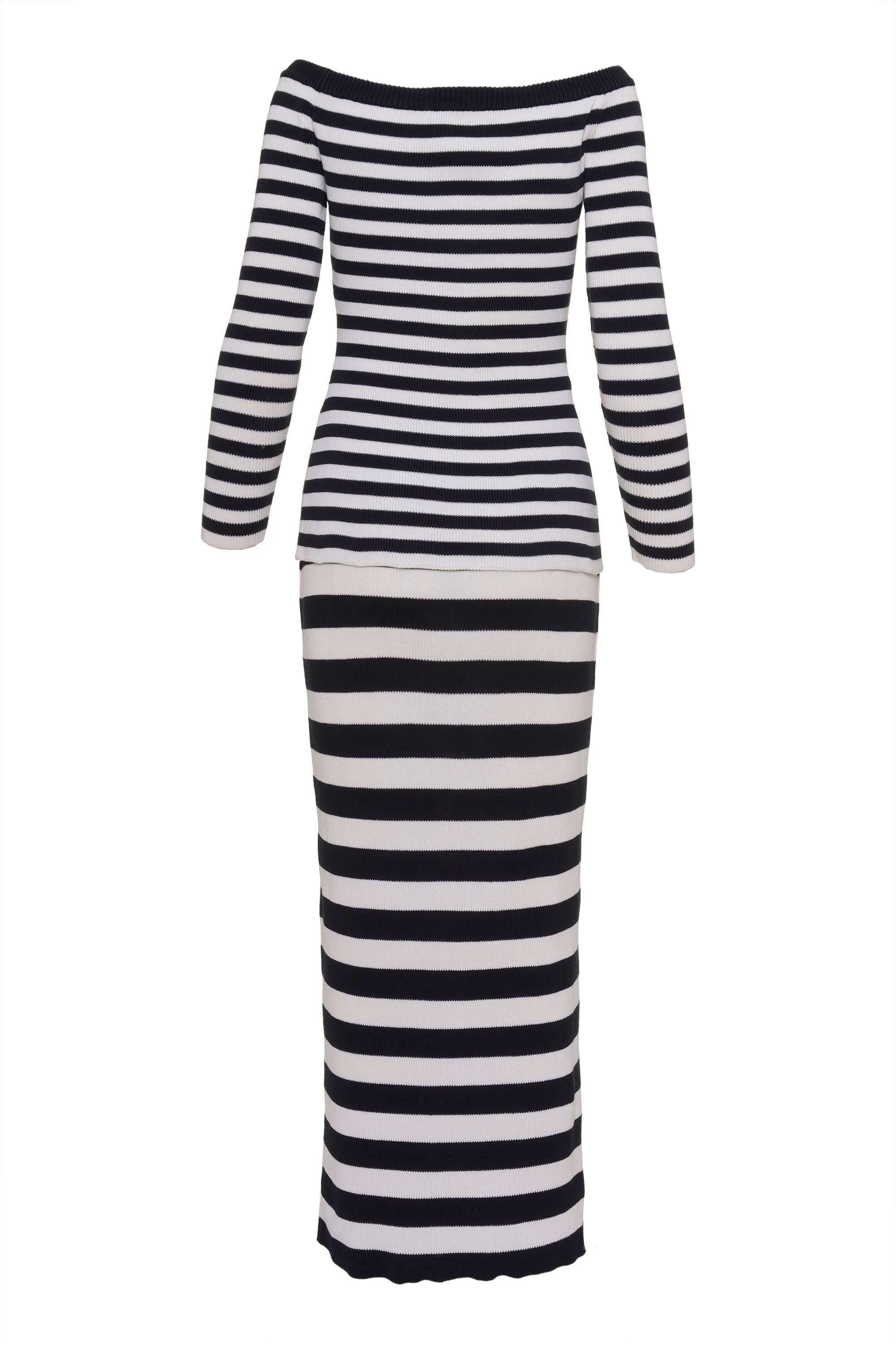 This striped black and white Sweater by SALVATORE FERRAGAMO has off-the-shoulder neckline and long sleeves, the skirt is long, and has stretched waist closure. both of the items have jersey knit textile. Made in Italy.

Lable: Salvatore