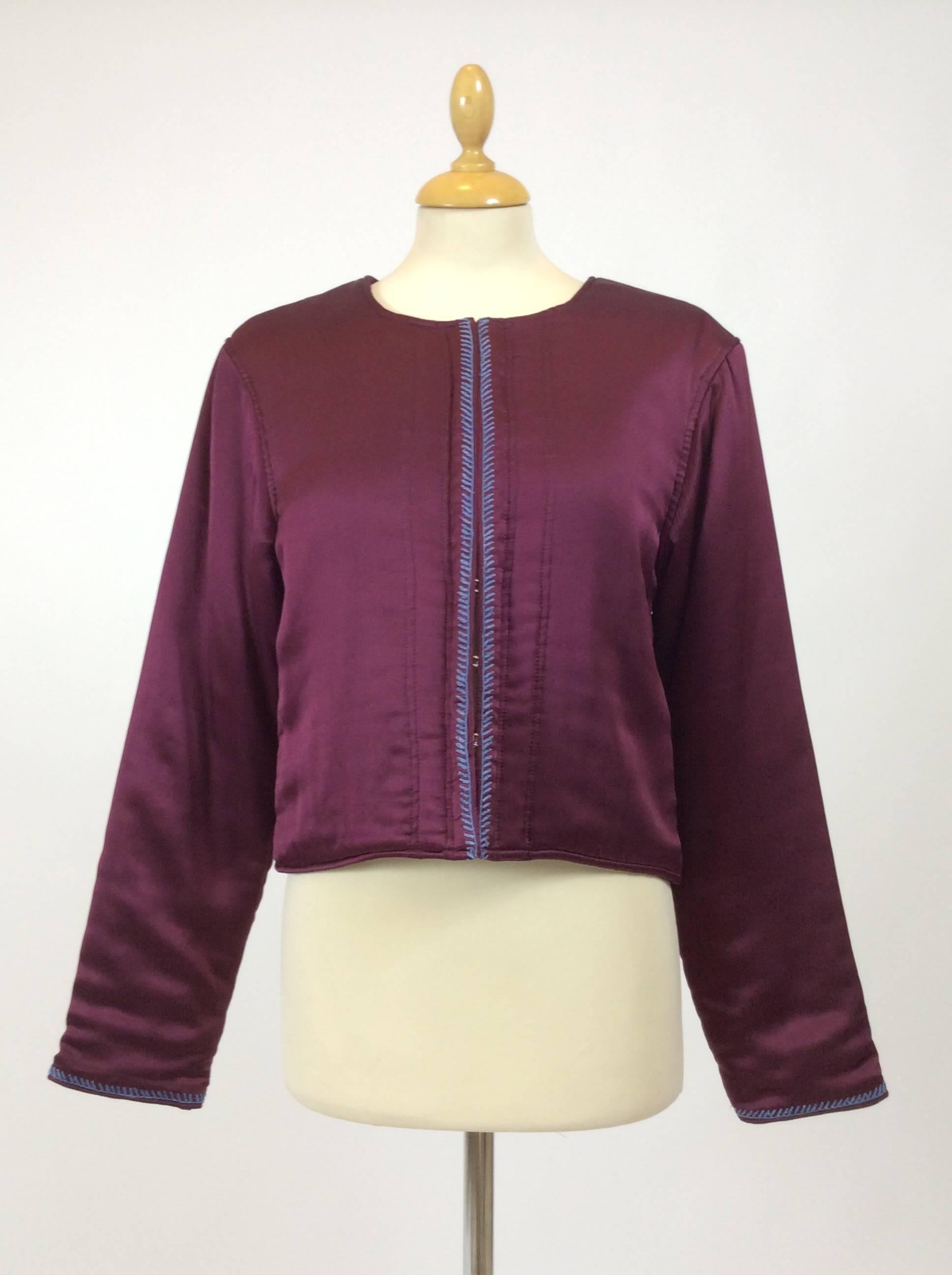 This stunning Lanvin Bolero jacket is made with burgundy red silk padded fabric.It has light blue stitch hem, hooks closure and fully lined.

Measurement:
Estimeted size S/M
Shoulder 16 inch
Sleeve 24 inch
Bust 34 inch
Total length 18 inch