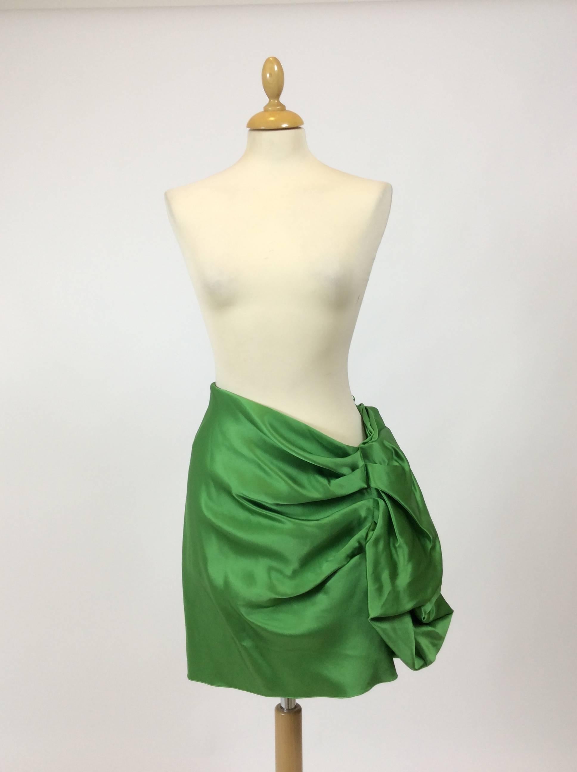 This amazing Lanvin skirt is in fabulous green silk satin fabric. It has a lovely side drapery with flounce and side zip closure. 

Measurements:
Estimated size S/M
Waist 30 inch
Hips 40 inch
Total length 24 inch