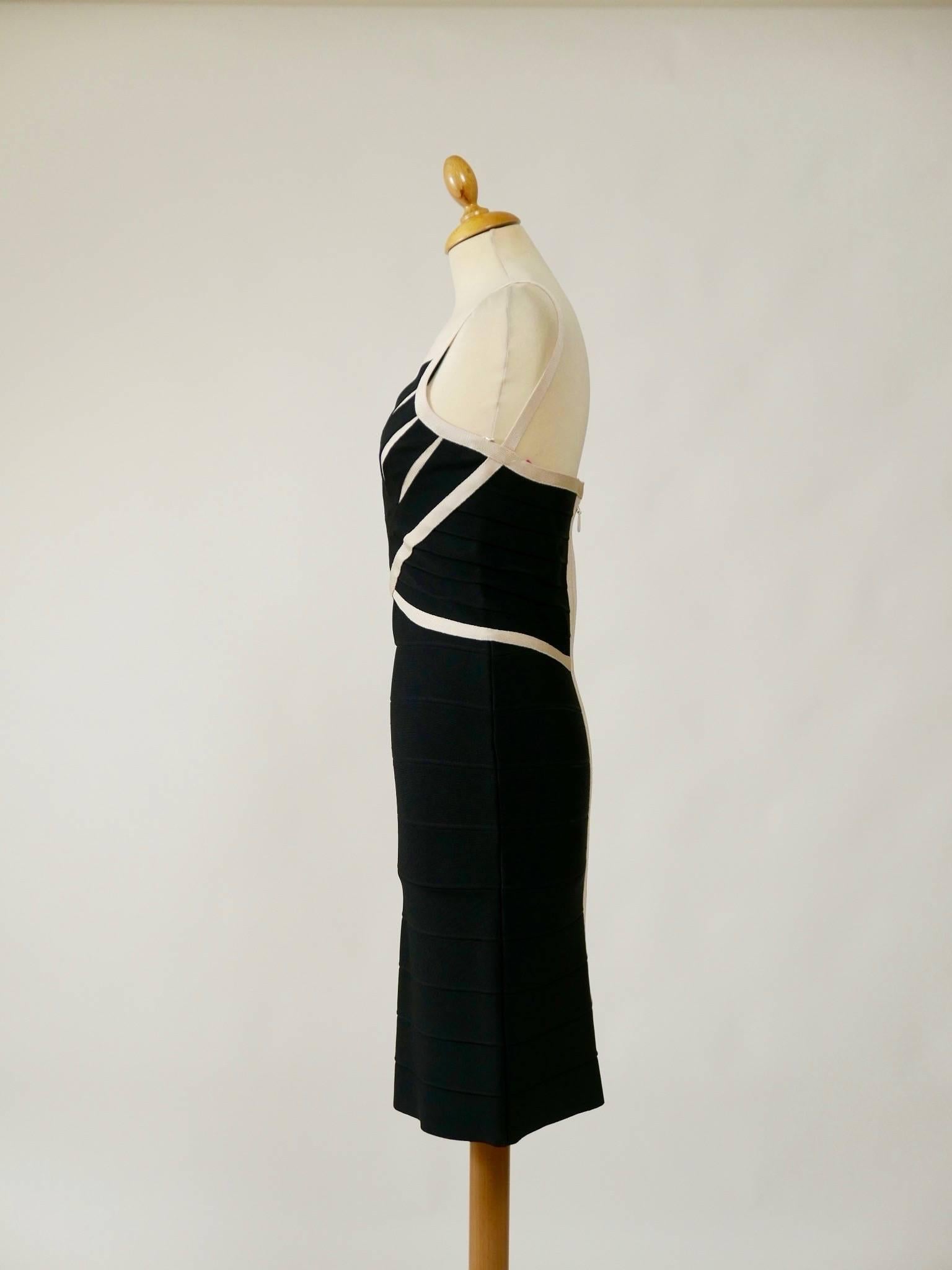 This bombshell Herve Leger sexy dress is in black and white asymmetric bandage and jersey fabric. It has hourglass line and back zip closure. 

Measurement (unstretched):
Label size S
Estimeted size S
Bust 32 inch
Waist 24 inch
Hips