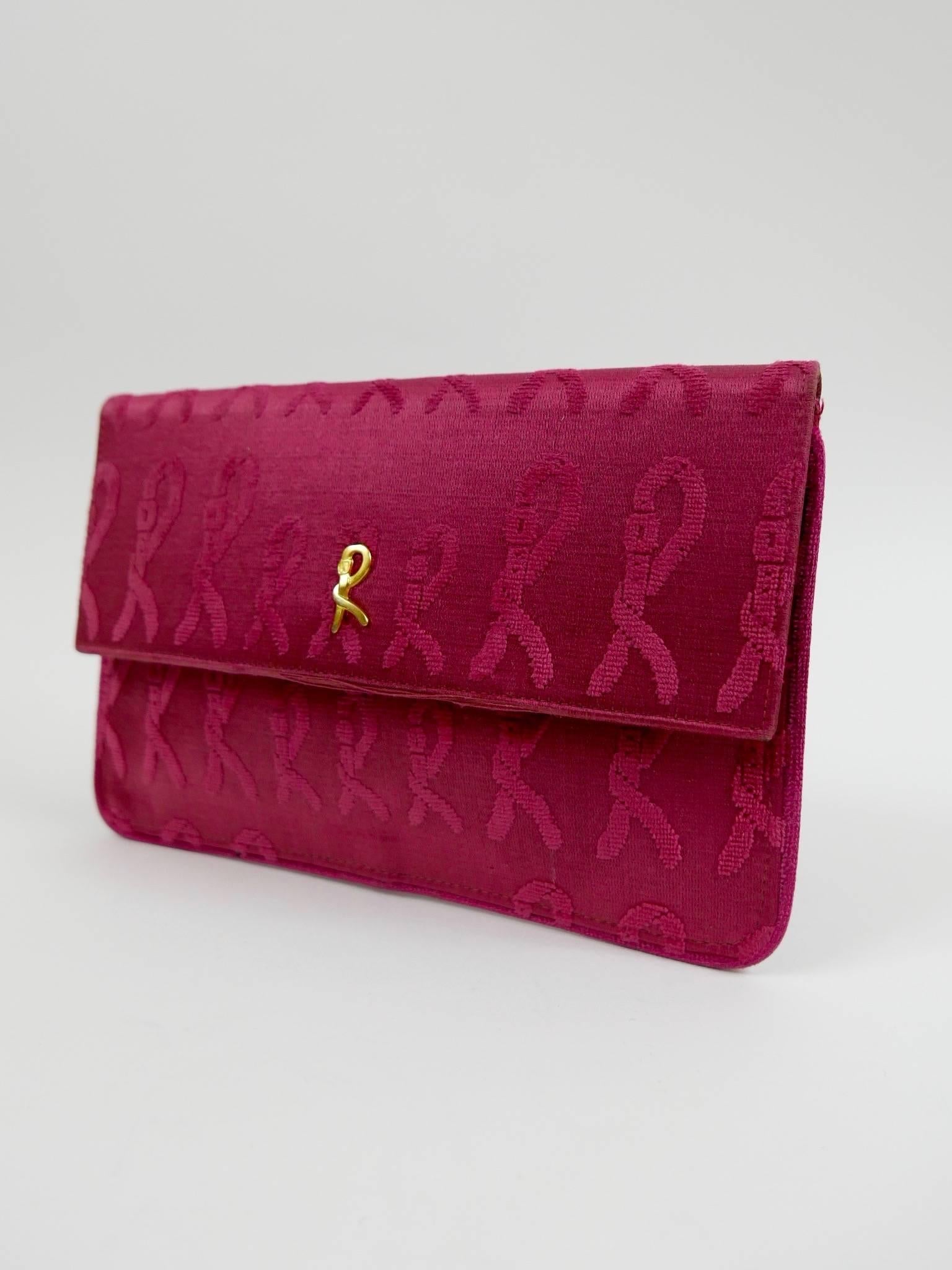 This authentic 1960s Roberta Di Camerino purse is in a red fabric with soft velvet cut with typical prints of the designer. It has golden metal designers signature ''R