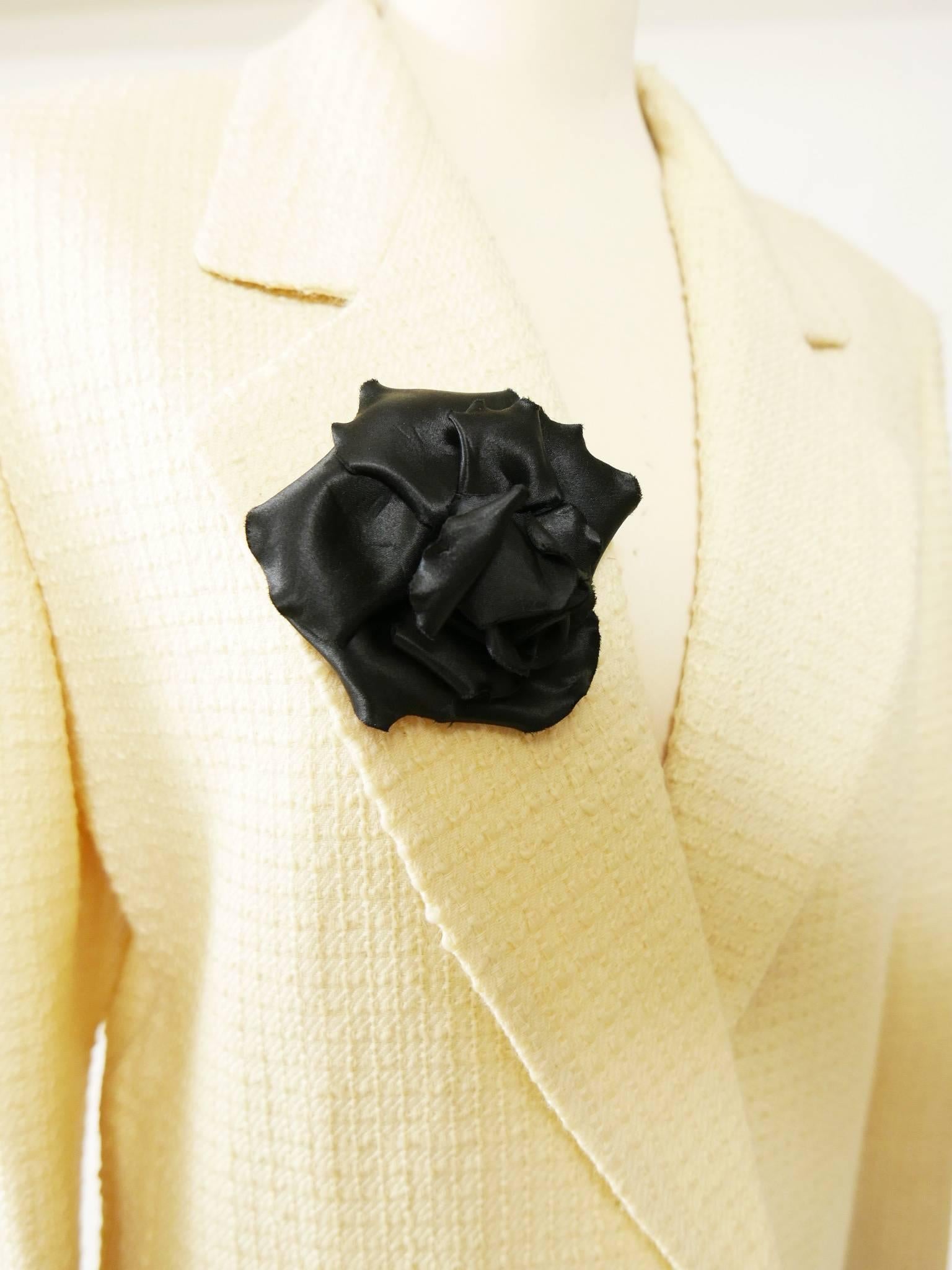 This gorgeous Authentic Chanel Rose flower Brooch is in black satin. It has Chanel CC Made in France engraved on the back. It has a pin with secure closure. 
Can be attached to your Jacket or secure your scarf or used as accessory.  
Is the