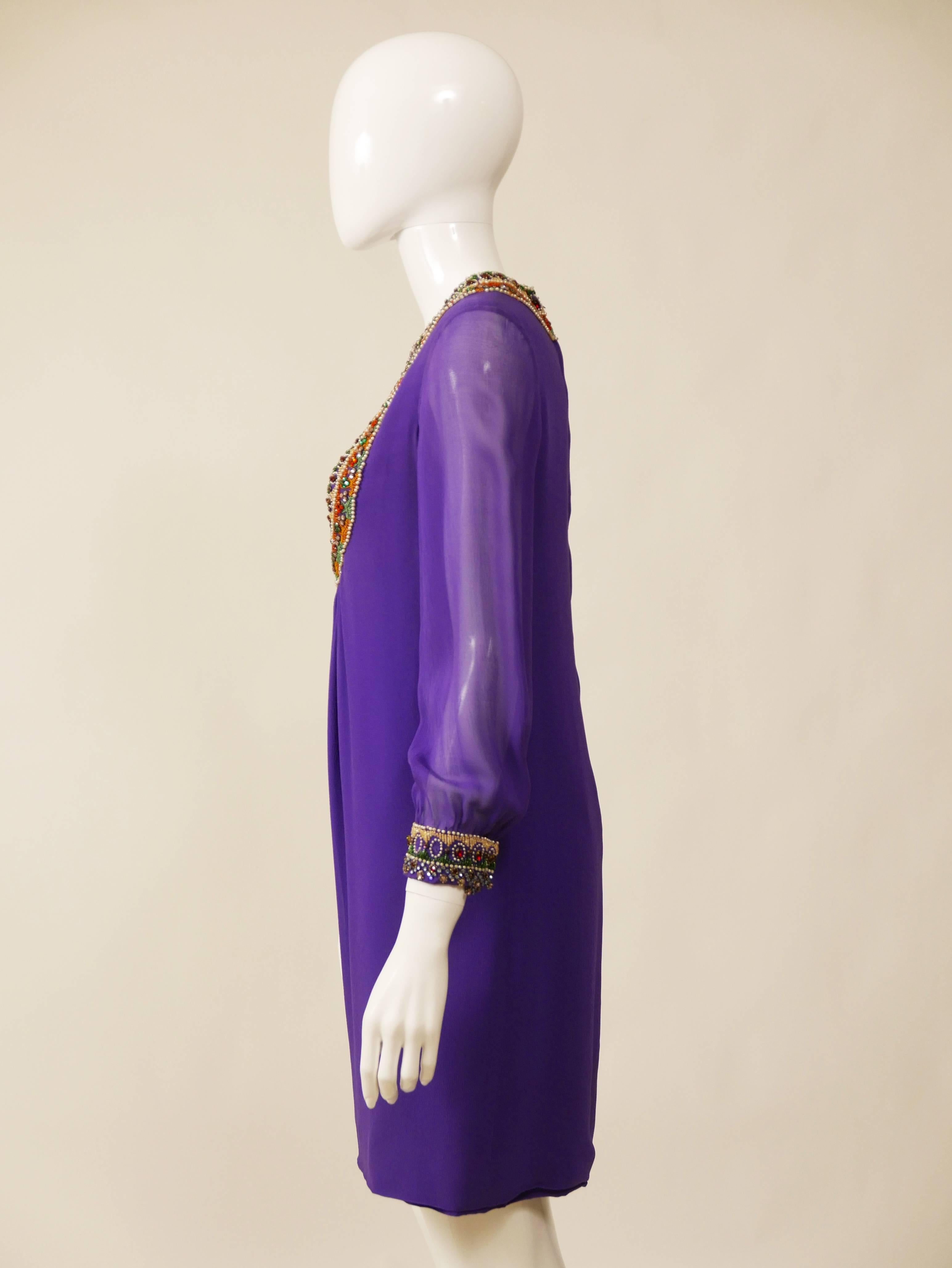 This amazing 1970s mini dress is in a purple crepe silk fabric with a gorgeous beadeds and rhinestones embroidered trim details. It has double back zip closure and is fully lined.

Very good vintage condition 

Label: N/A
Fabric: Silk
Color: