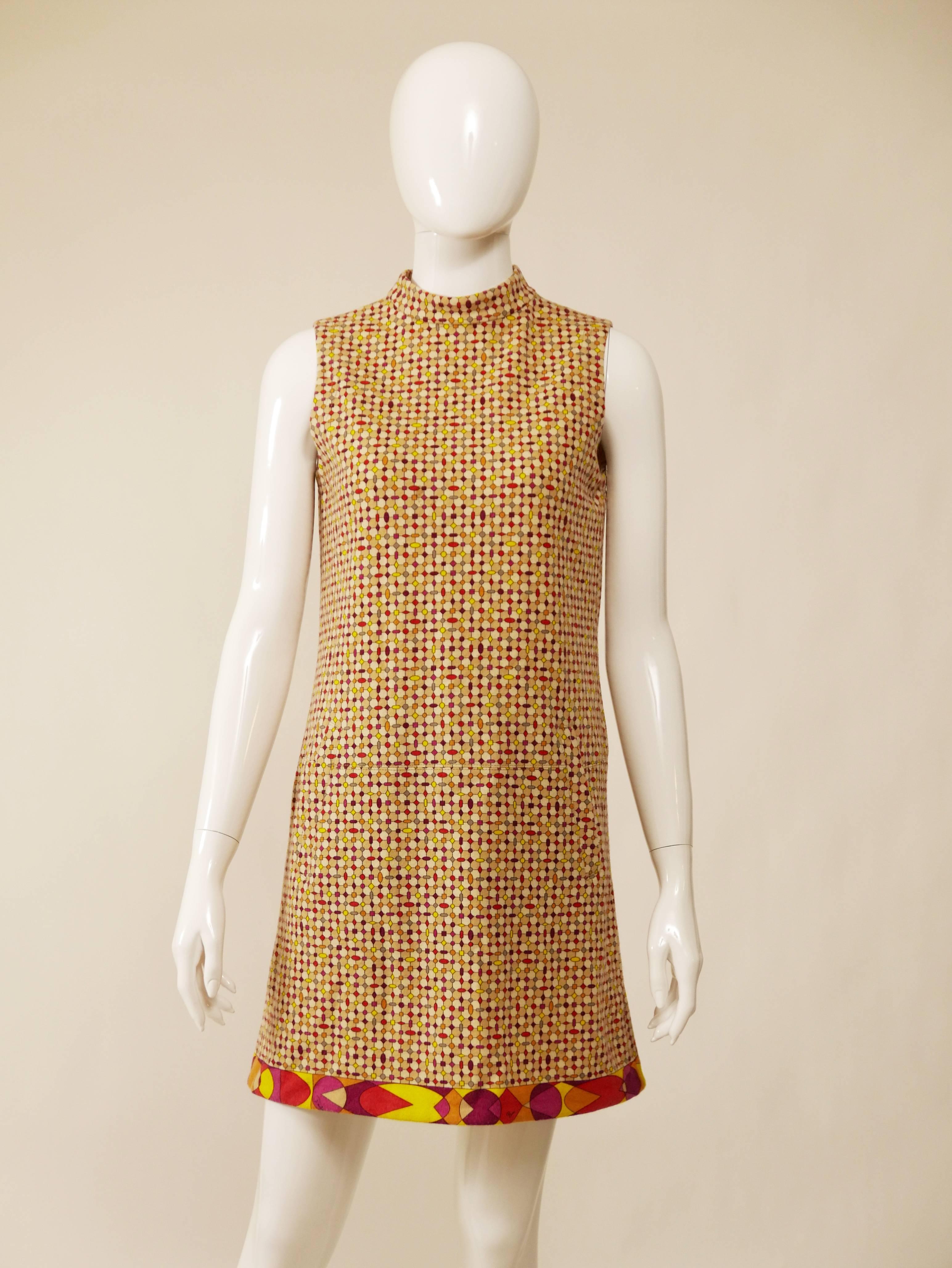 This lovely Emilio Pucci dress is made of wooden soft stretch fabric with exotic and colorful Pucci style print. It has back zip closure and hidden pockets.

Very good condition

Label: Emilio Pucci
Fabric: wool
Color: cream/red/magenta/beige/yellow