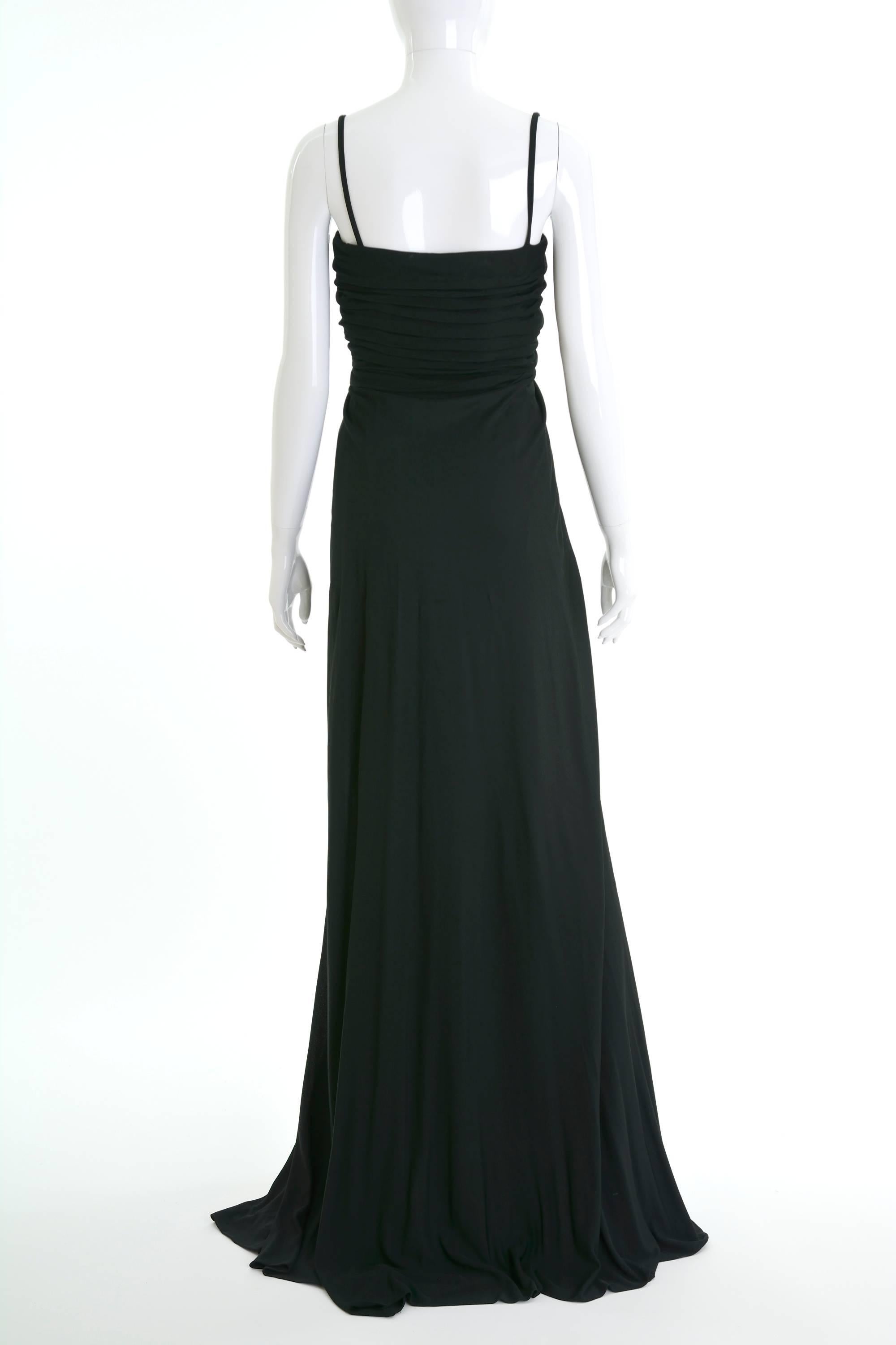 This lovely 1970s Italian Couture long dress is in black jersey fabric with draped details. It has spaghetti straps, boning bodice and back zip closure. 

Good vintage condition

Label: SORELLE CHIOSTRI Firenze
Fabric: jersey silk
Color :