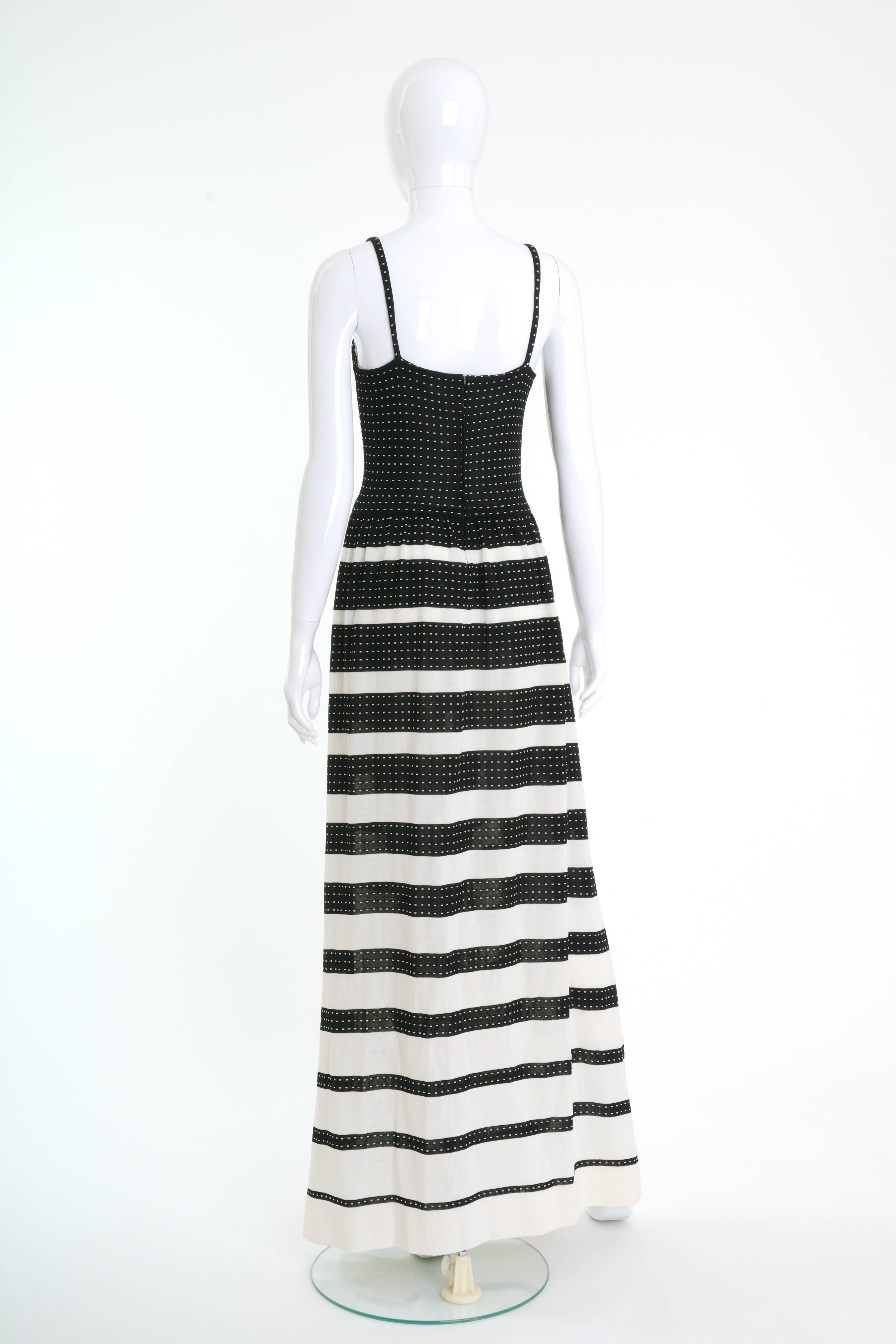This lovely 1970s Lanvin long dress is in black and white knitted fabric with striped print skirt. It has spaghetti straps and back zip closure. 

Very good vintage condition

Label: Lanvin Paris
Fabric: polyester 
Color :
