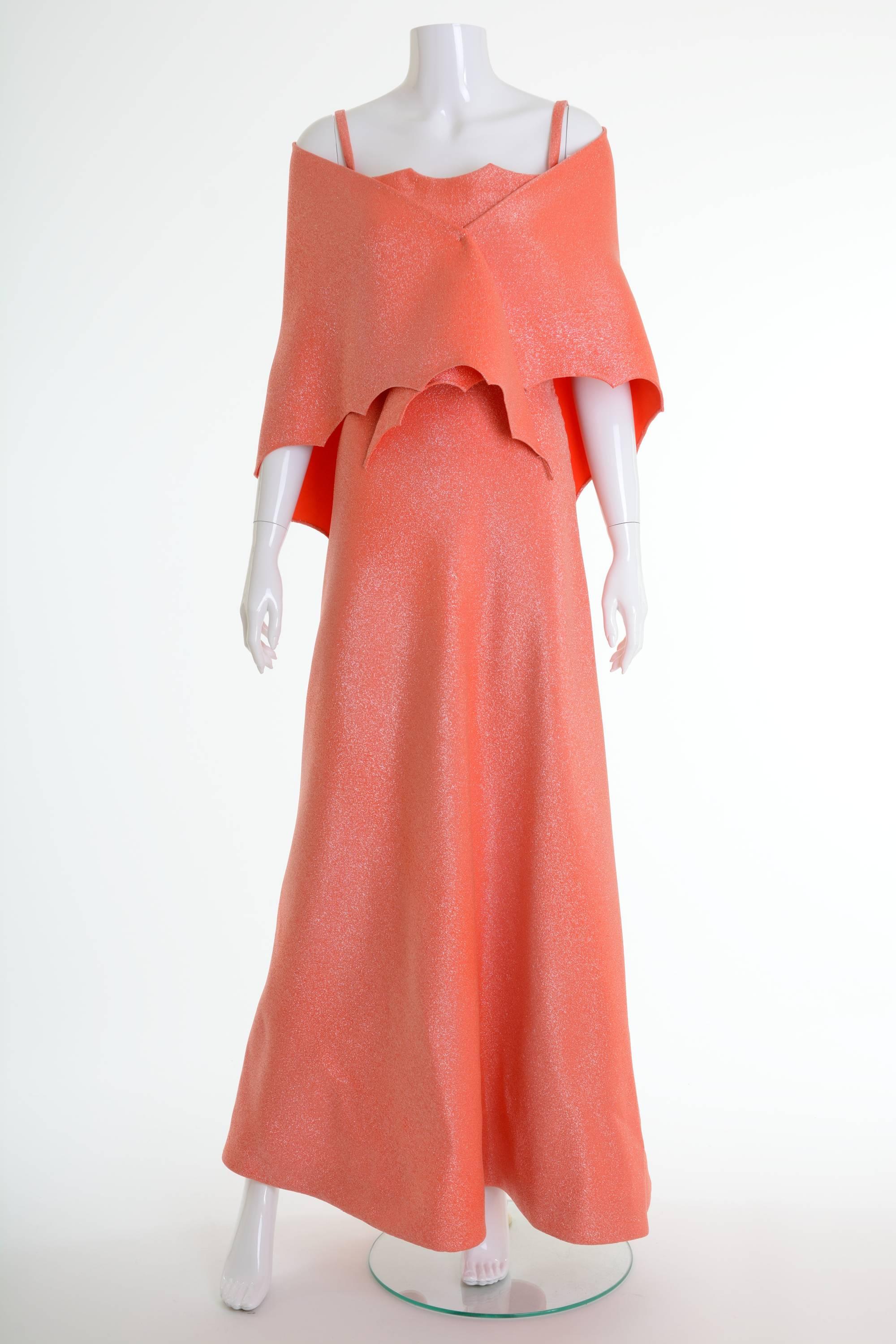 This gorgeous 1960s Curiel Italian Couture long dress is in orange lurex fabric. It has spaghetti straps, boning bodice and side zip closure. It's fully lined. It's included a lovely stole.

In 1945, Gigliola Curiel, the niece of Ortensia Curiel,