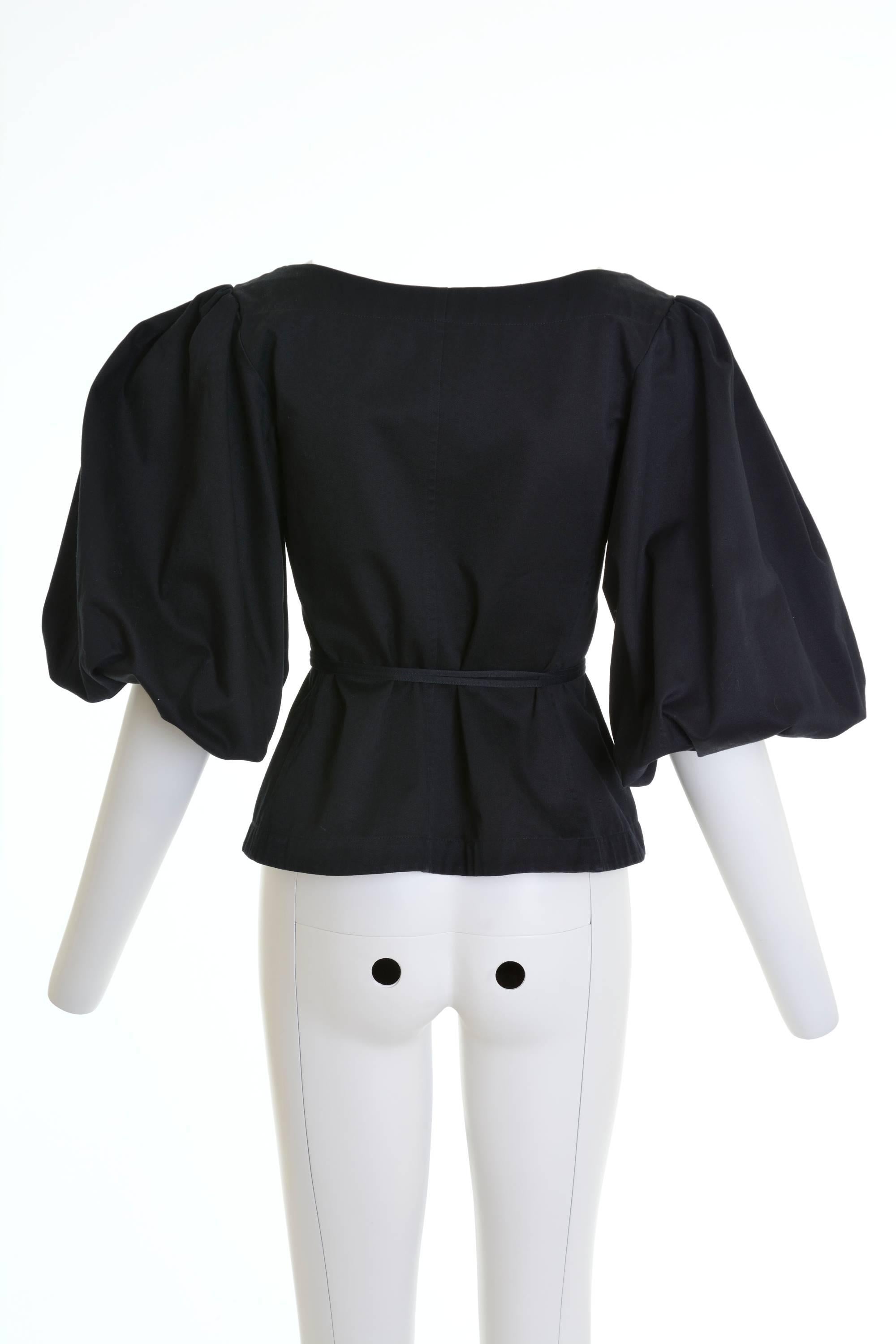 This amazing and Iconic YVES SAINT LAURENT Rive Gauche 1990s blouse shirt is in a black pique cotton fabric with large balloon sleeve and lace up closure.

Excellent vintage condition

Label: Yves Saint Laurent Rive Gauche (made in France)
Fabric: