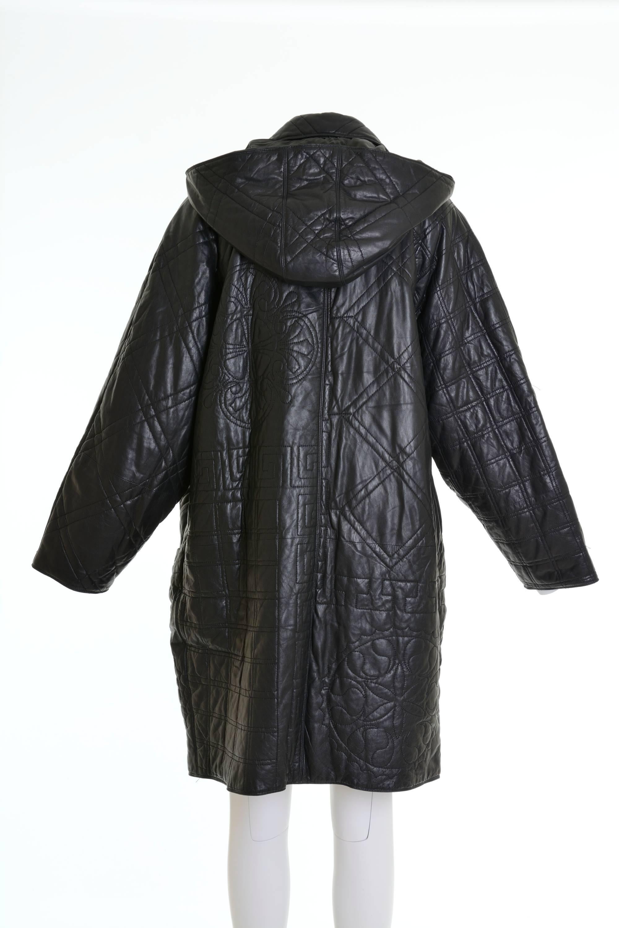 1980s Gianni Versace long jacket in leather fabric. Abstract top stitches, removable hood, toggle and zip closure, patch pockets, fully lined, inside pocket.

Excellent Vintage Condition

Measurements:
Estimated size: Oversize
Shoulders 24 in
Bust