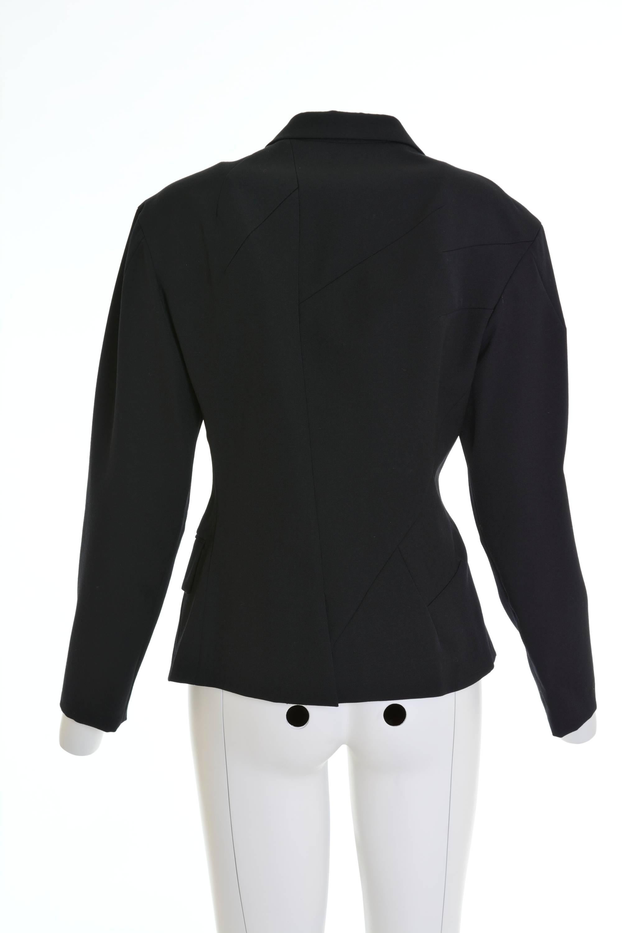 This iconic YOHJI YAMAMOTO Blazer Jacket is in black woolen gabardine fabric and has asymmetric construction, one flap pocket, double breasted closure and is fully satin lined.

Excellent condition

Label: Yohji Yamamoto 
Fabric: wool
Color: