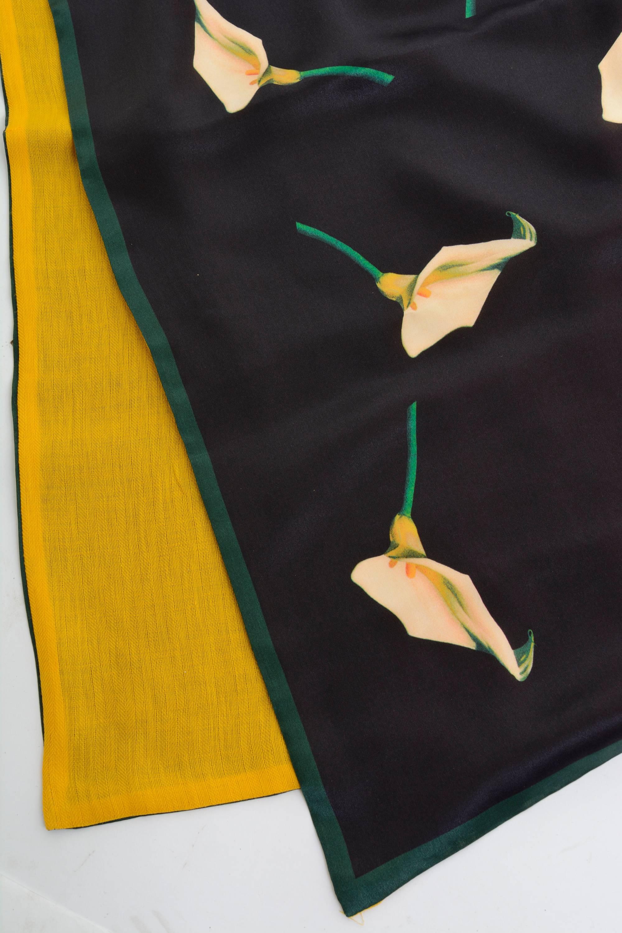 Yves Saint Laurent stole in a black silk fabric with calla lilies textile and in yellow wool fabric on the other side, never worn with tag. Made in Italy

Condition Never Worn

Label: Yves Saint Laurent
Fabric: silk/ fabric
Colour: black, yellow,