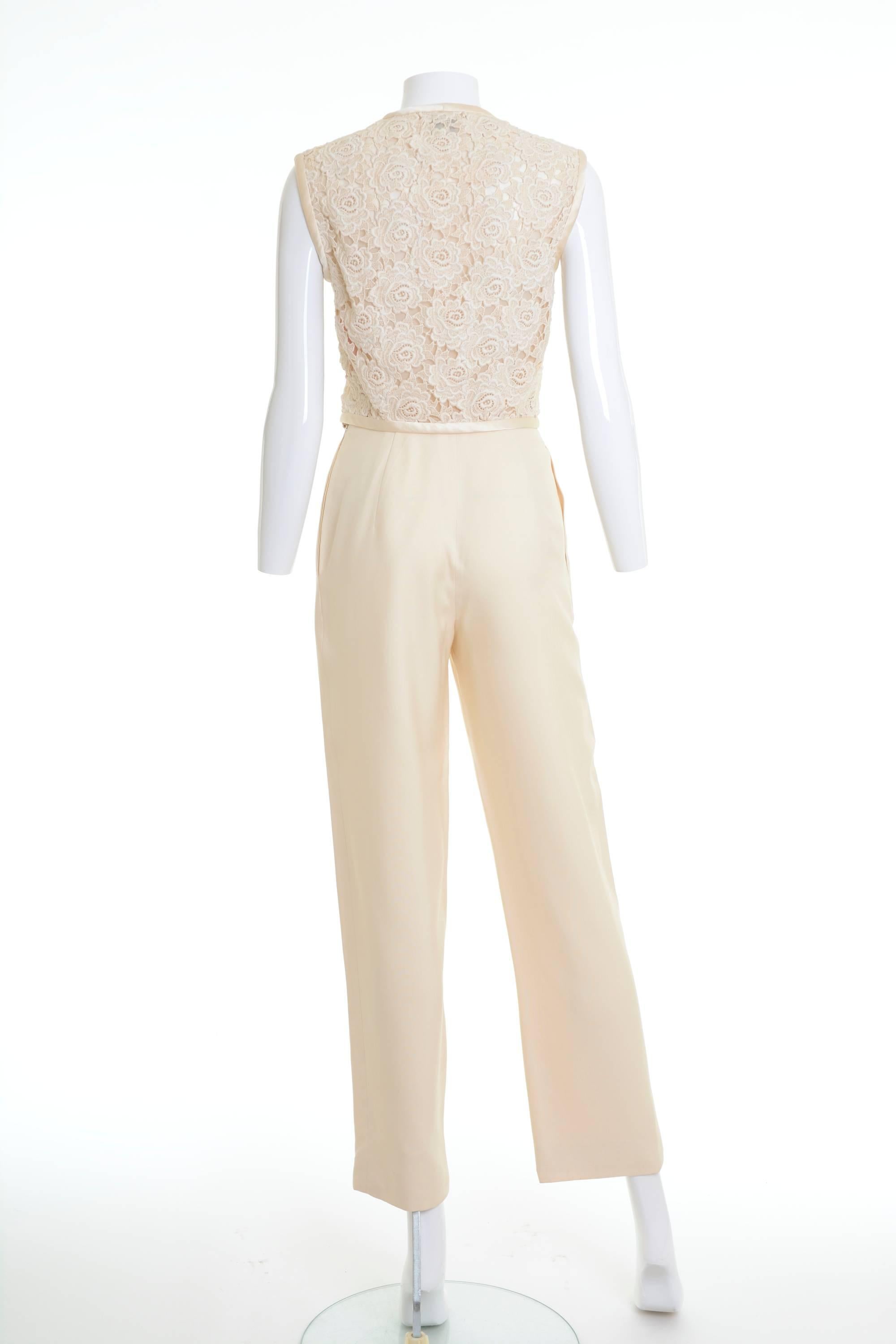 1980's Valentino Boutique cream suit pants. Blouse shirt in a crochet fabric, silk edges, buttons with beads, chiffon lining. Tailored pants in a gabardine cotton fabric, side zip closure, seam pockets, fully lined. Made in Italy 

Excellent Vintage