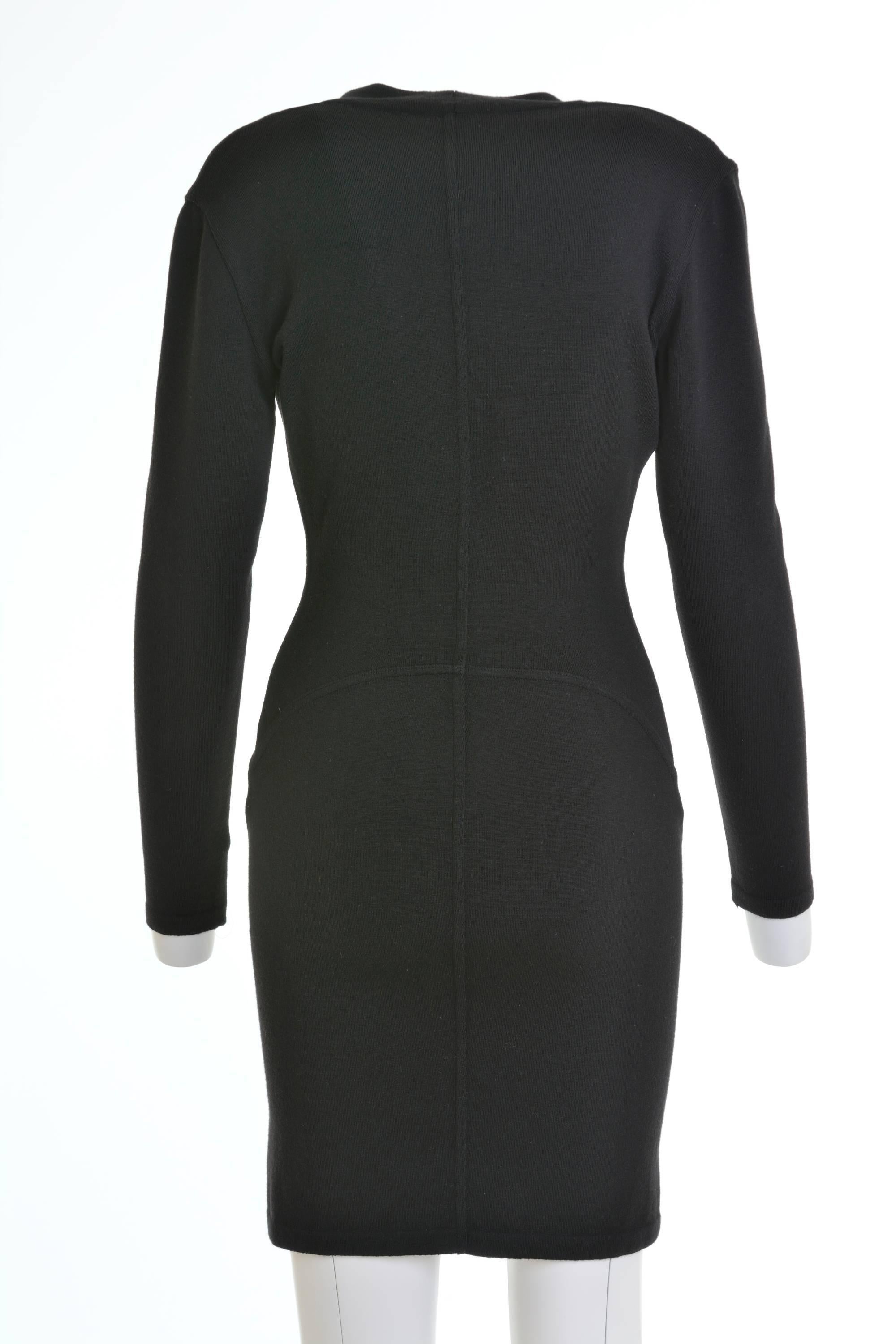 1990s Azzedine Alaïa mini dress in a black wool stretch fabric, with typical Alaïa's signature body. Long sleeves and pencil skirt, U-line neck.

Excellent vintage condition  

Label: Alaïa-Paris (Made in Italy) 
Fabric: wool/polyamide/elastane