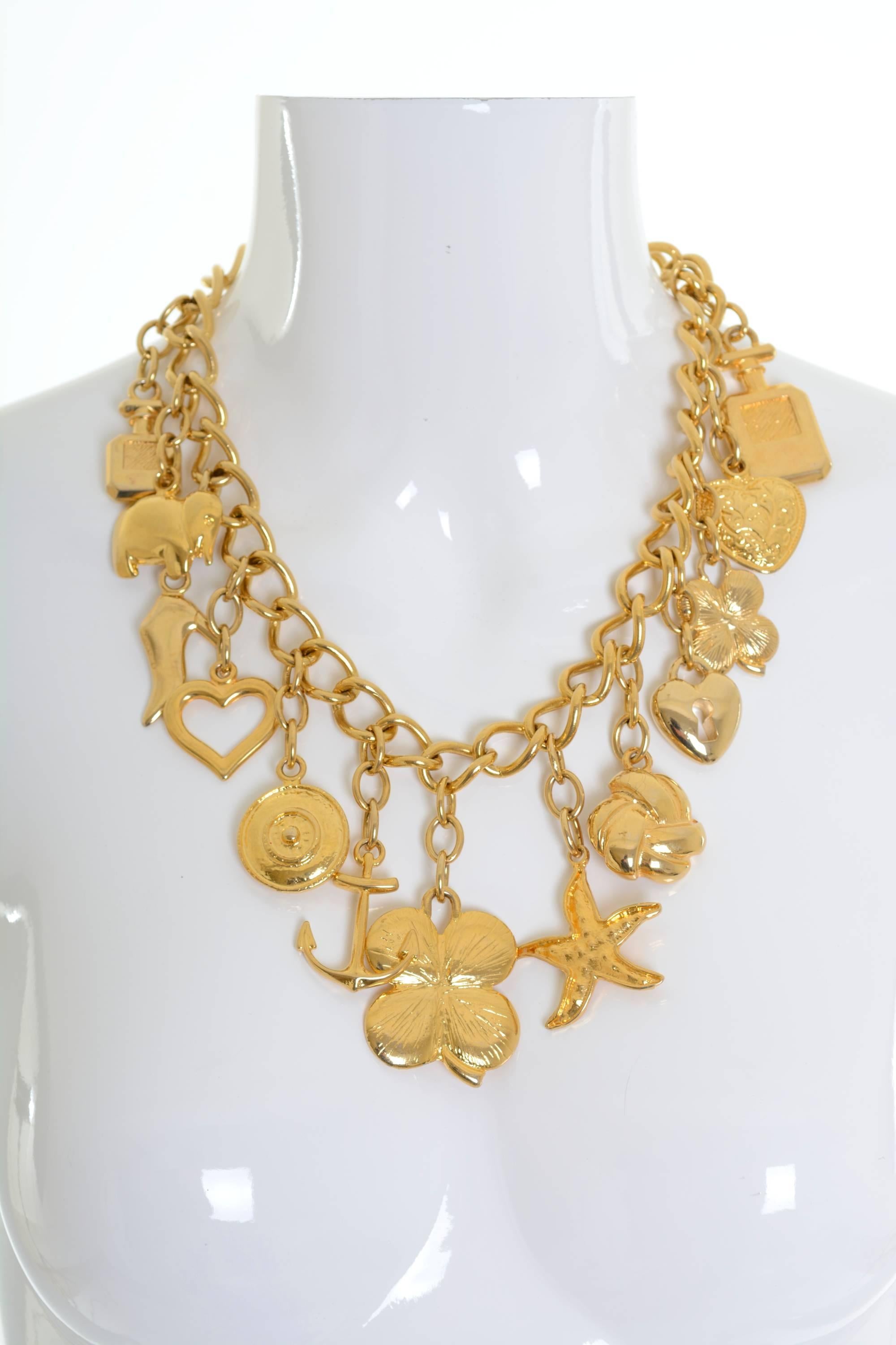 This stunning Ugo Correani large chain necklace has lovely golden metal charms. 

UGO CORREANI (1935 - 1992) was an Italian fashion designer specializing in accessories and jewelry design.
Born in Frascati, at 20 years old Correani moved to Milan to