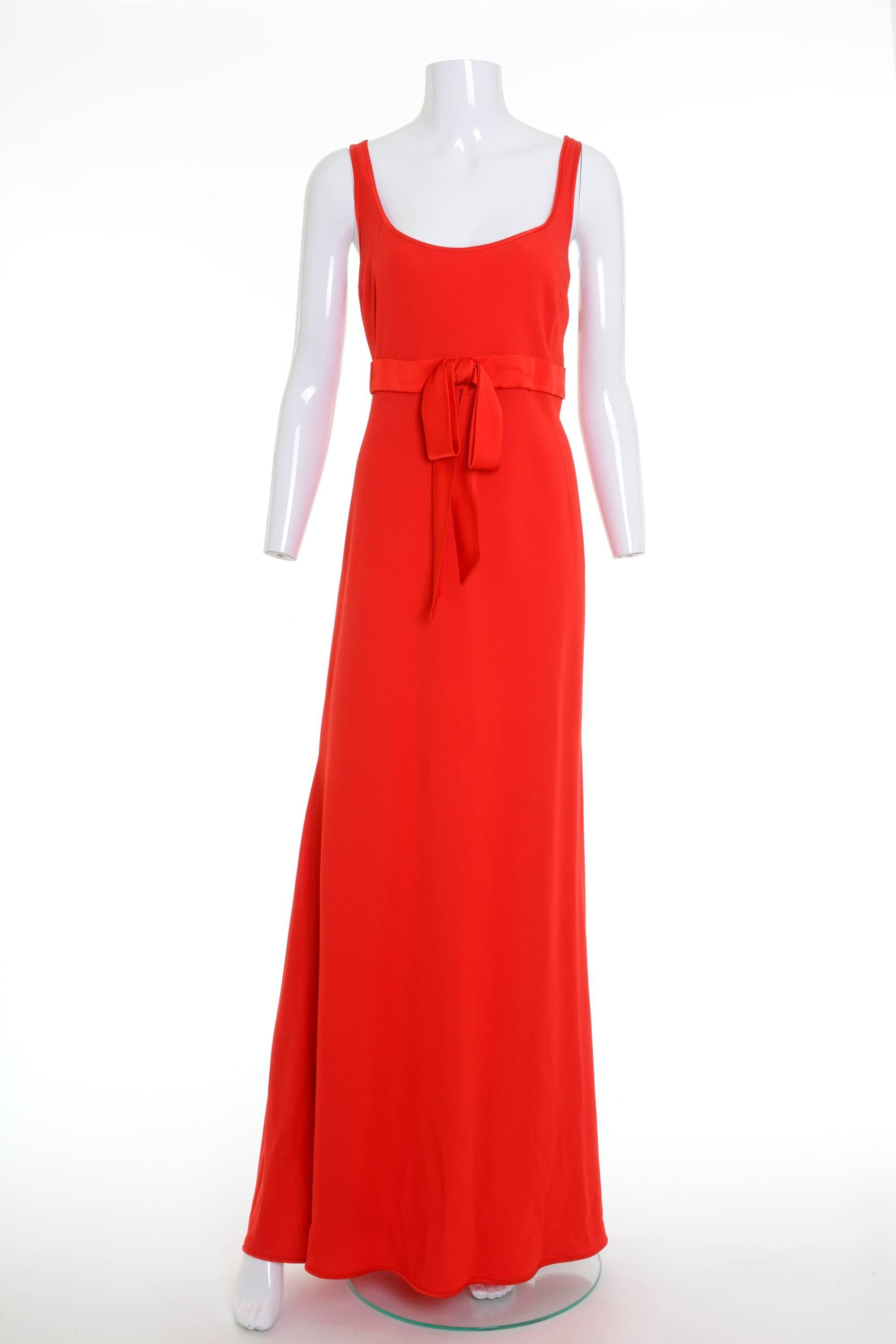 This stunning long dress is made of Valentino Tissus red satin silk fabric. It's sleeveless, with side zip closure and has bow satin empire waistband. It's fully lined.

Measurements:
Estimated size M
Bust  40 inch
Empire Waist 34 inch
Hips 44