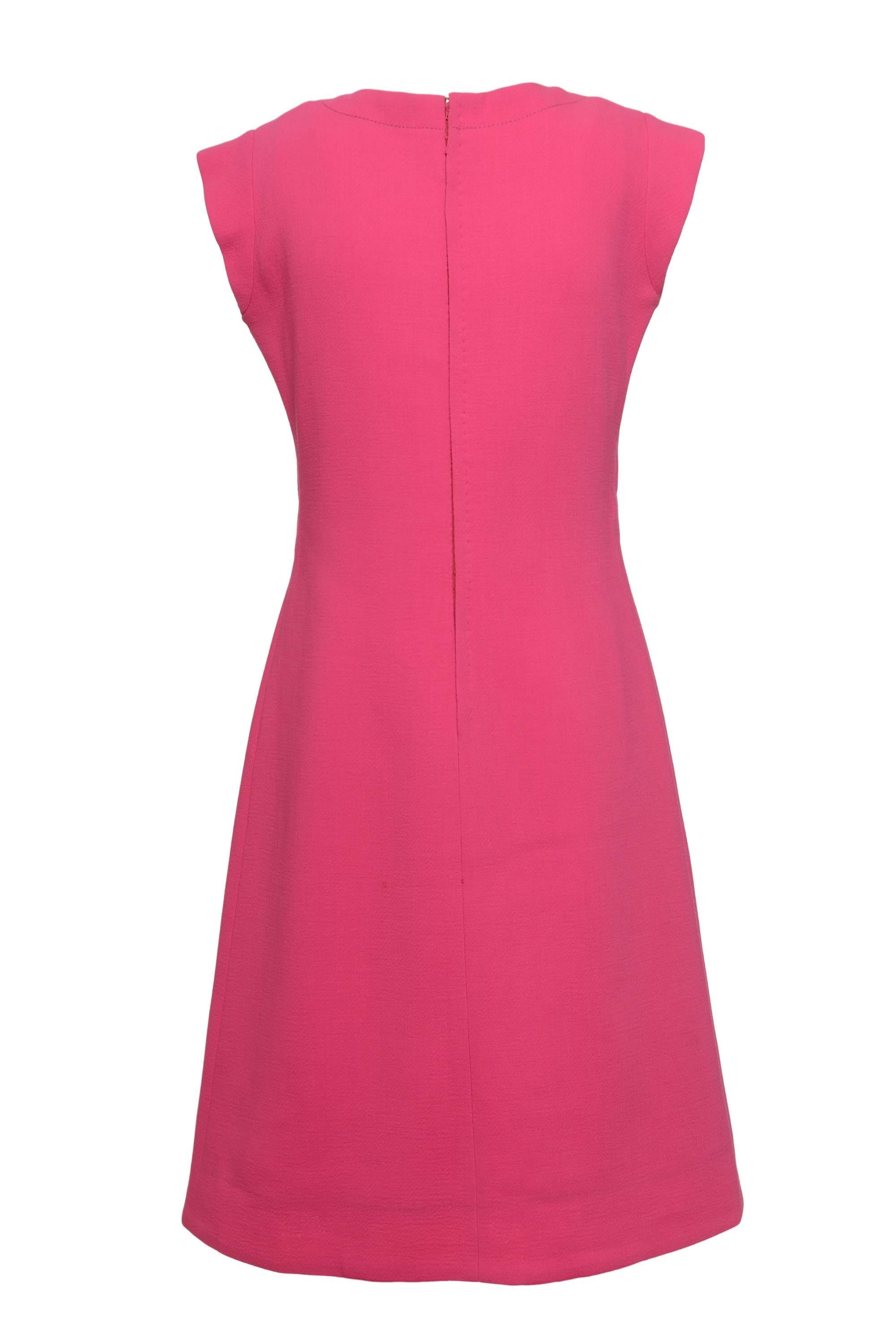 This gorgeous 1960s PIERRE CARDIN Mod dress is in shocking pink woolen fabric. It has tie frontal closure and back zip closure. It's fully satin lined.

Good Vintage Condition 

Label: Pierre Cardin Boutique Paris
Fabric: Wool 
Color: Shocking